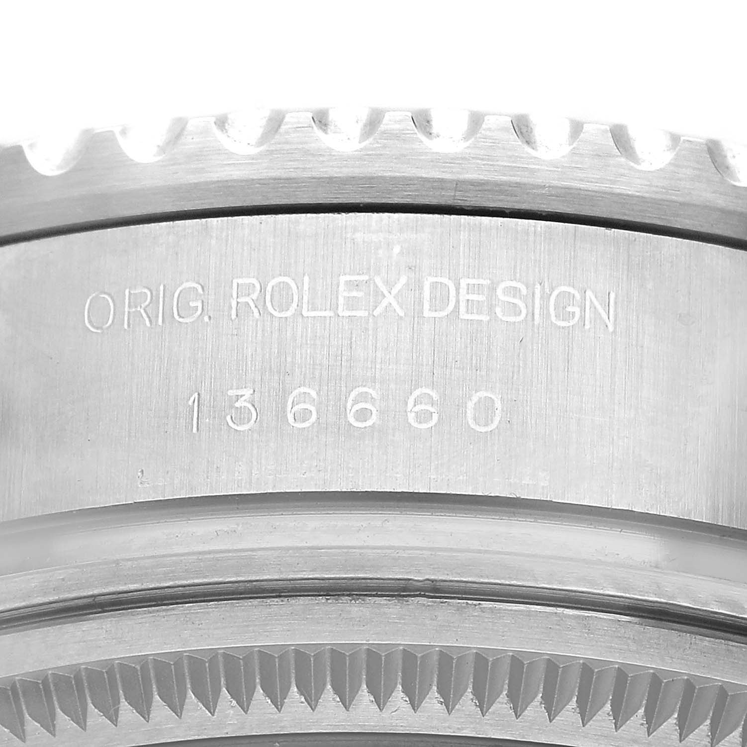 The image shows a close-up of the Rolex Sea-Dweller 136660 Men's Stainless Steel Blue Dial's side, highlighting the model number and design engraving.