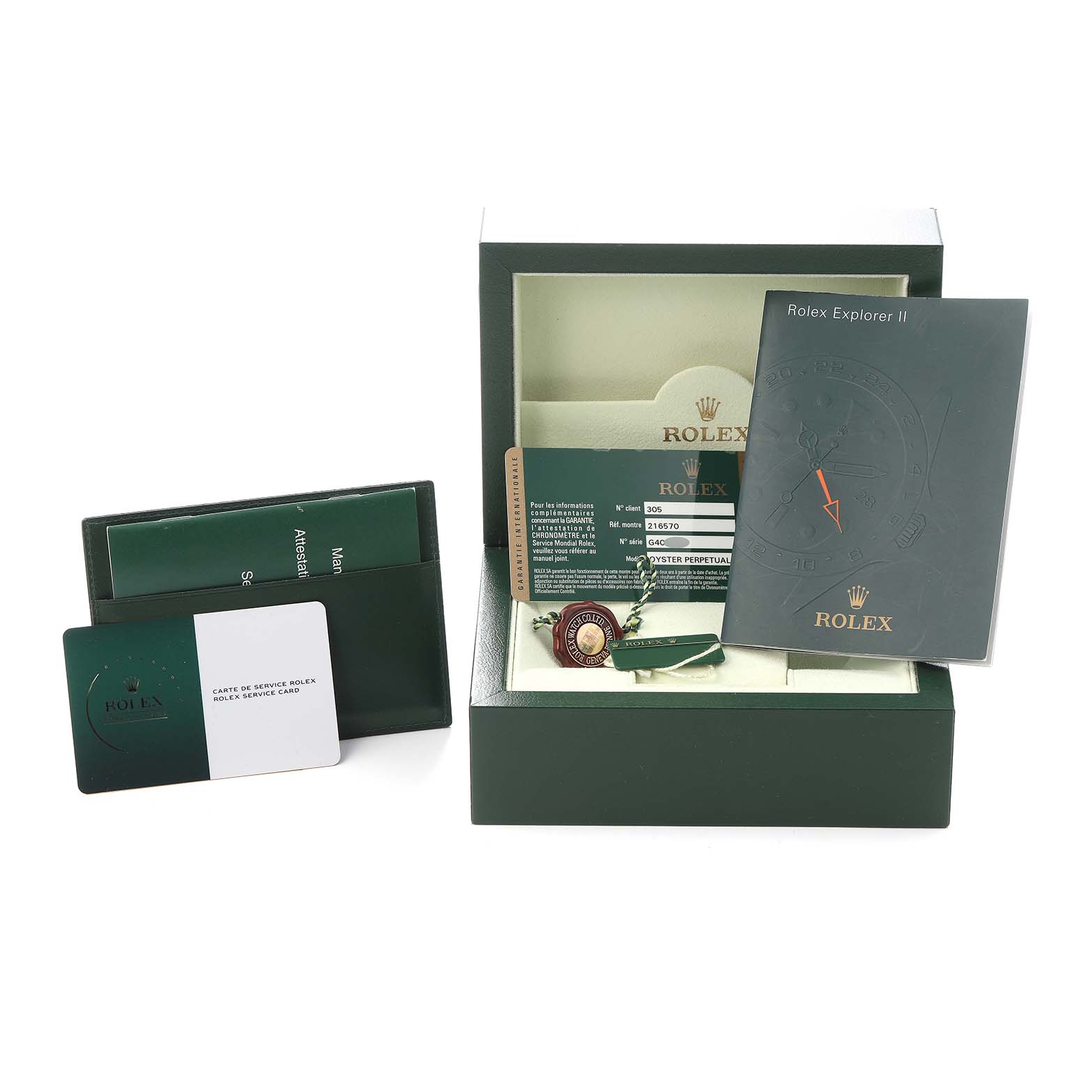 The image shows a top view of a Rolex Explorer 216570 Men
s Stainless Steel Black Dial 216570 Men
s Stainless Steel Black Dial box, papers, tag, and booklet.