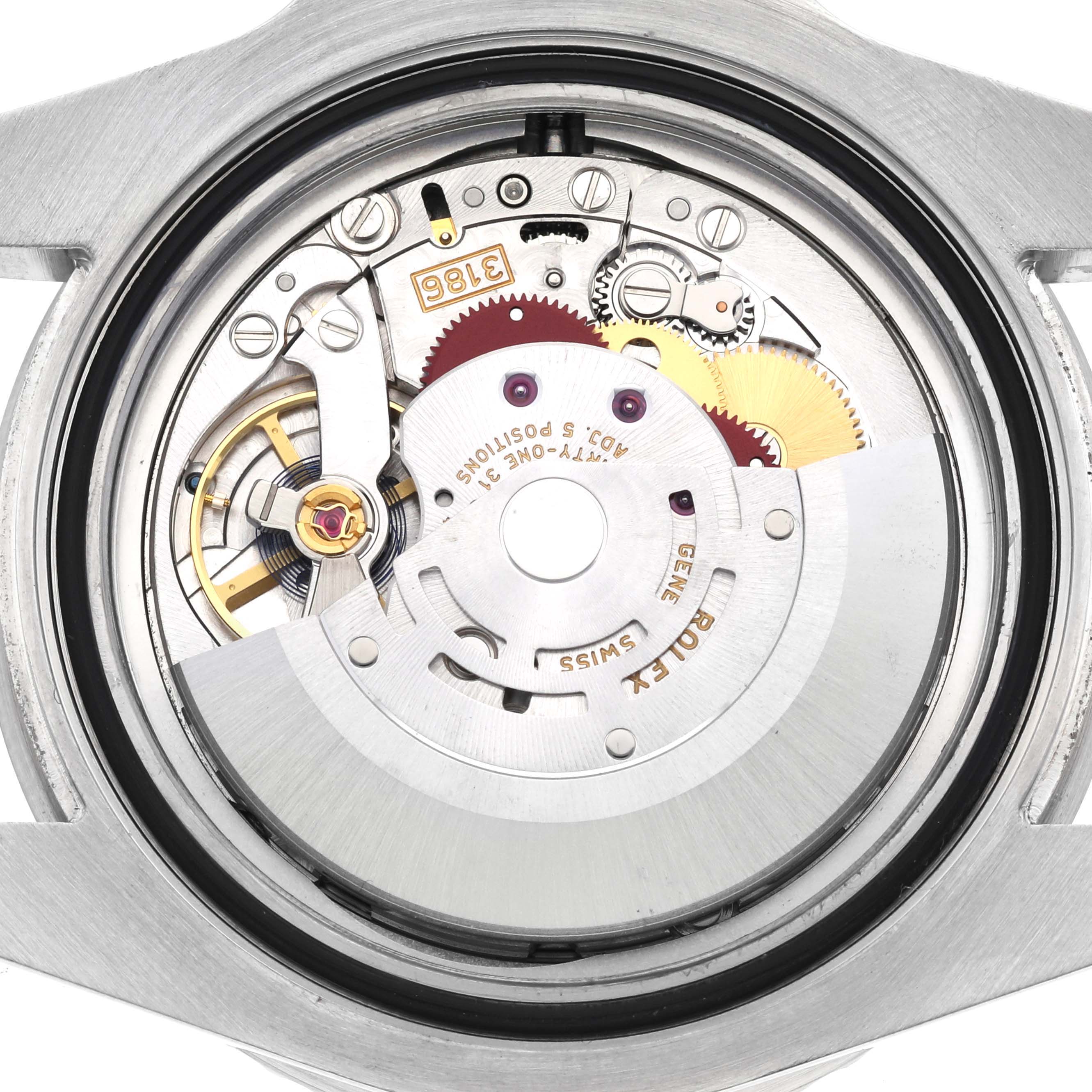 The image shows the internal movement mechanism of a Rolex GMT-Master 116710LN Men
s Stainless Steel Black Dial 116710LN Men
s Stainless Steel Black Dial watch from a top-down angle, displaying gears and components.