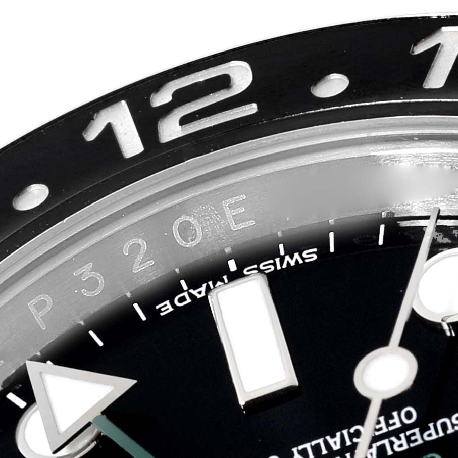 The image shows a close-up of the bezel, dial, and GMT hand of a Rolex GMT-Master 116710LN Men
s Stainless Steel Black Dial 116710LN Men
s Stainless Steel Black Dial watch.