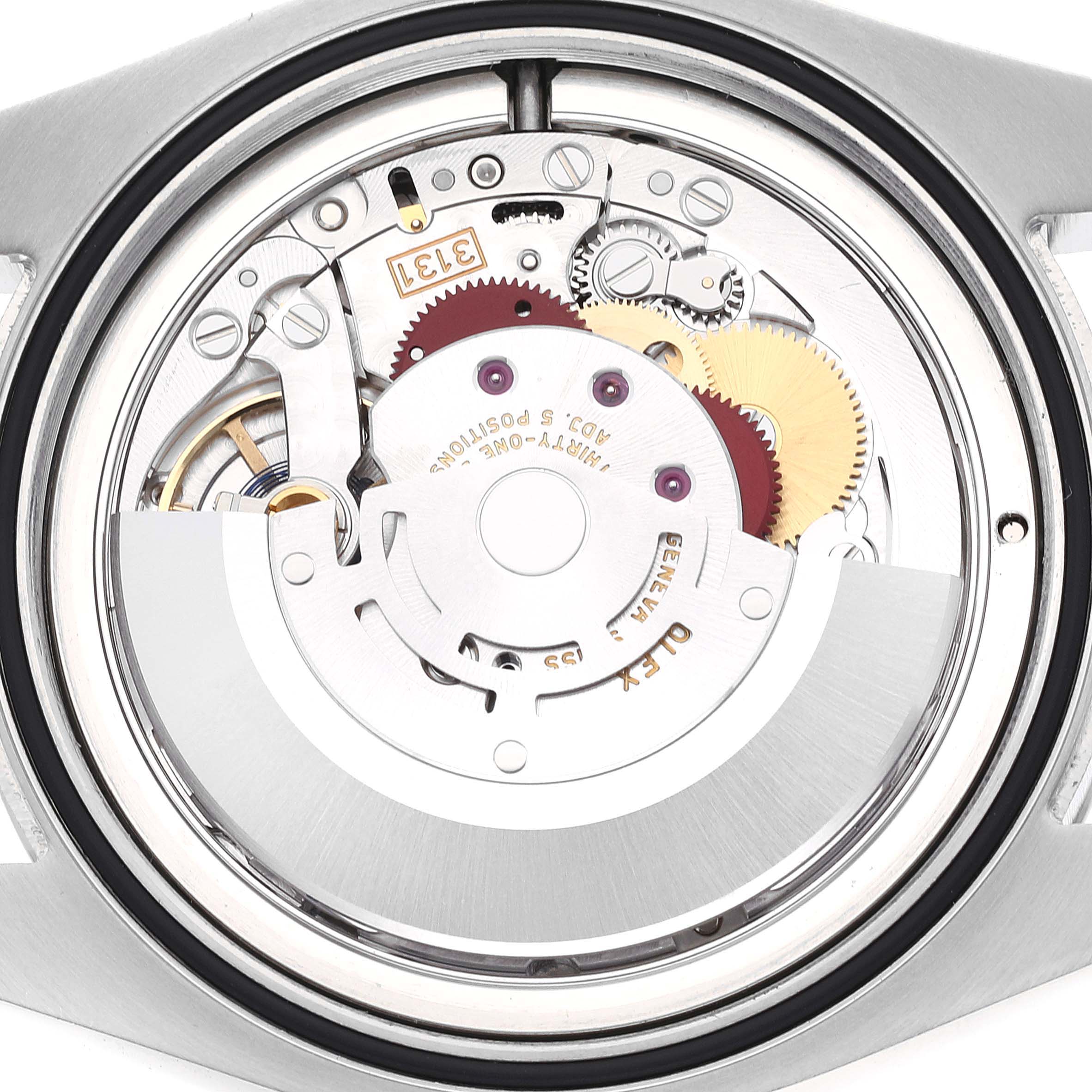 This is a close-up view of the movement and inner mechanical parts of a Rolex Air-King 116900 Men's Stainless Steel Black Dial 116900 Men's Stainless Steel Black Dial watch.