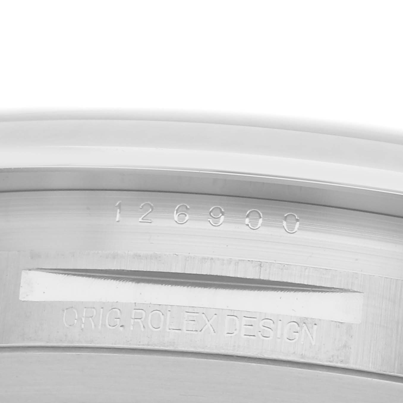 The image shows the inner rim of a Rolex Air-King 126900 Men's Stainless Steel Black Dial 126900 Men's Stainless Steel Black Dial watch, featuring the model number and "Orig. Rolex Design" engraving.