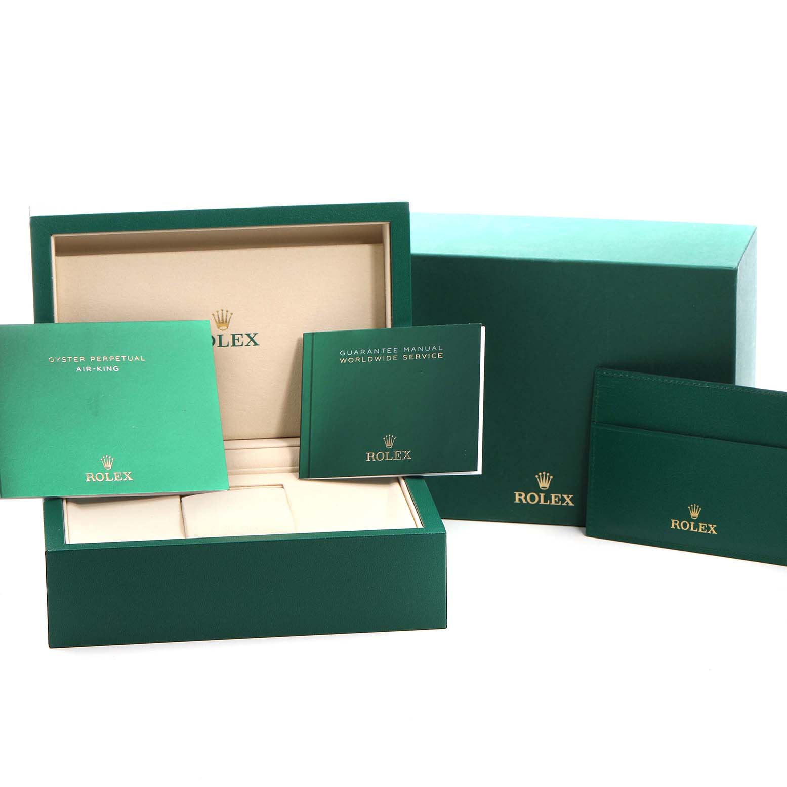 The image shows the packaging and booklets for a Rolex Air-King M126900-0001 Men's Stainless Steel Black Dial, including the box, warranty, and manuals viewed frontally.