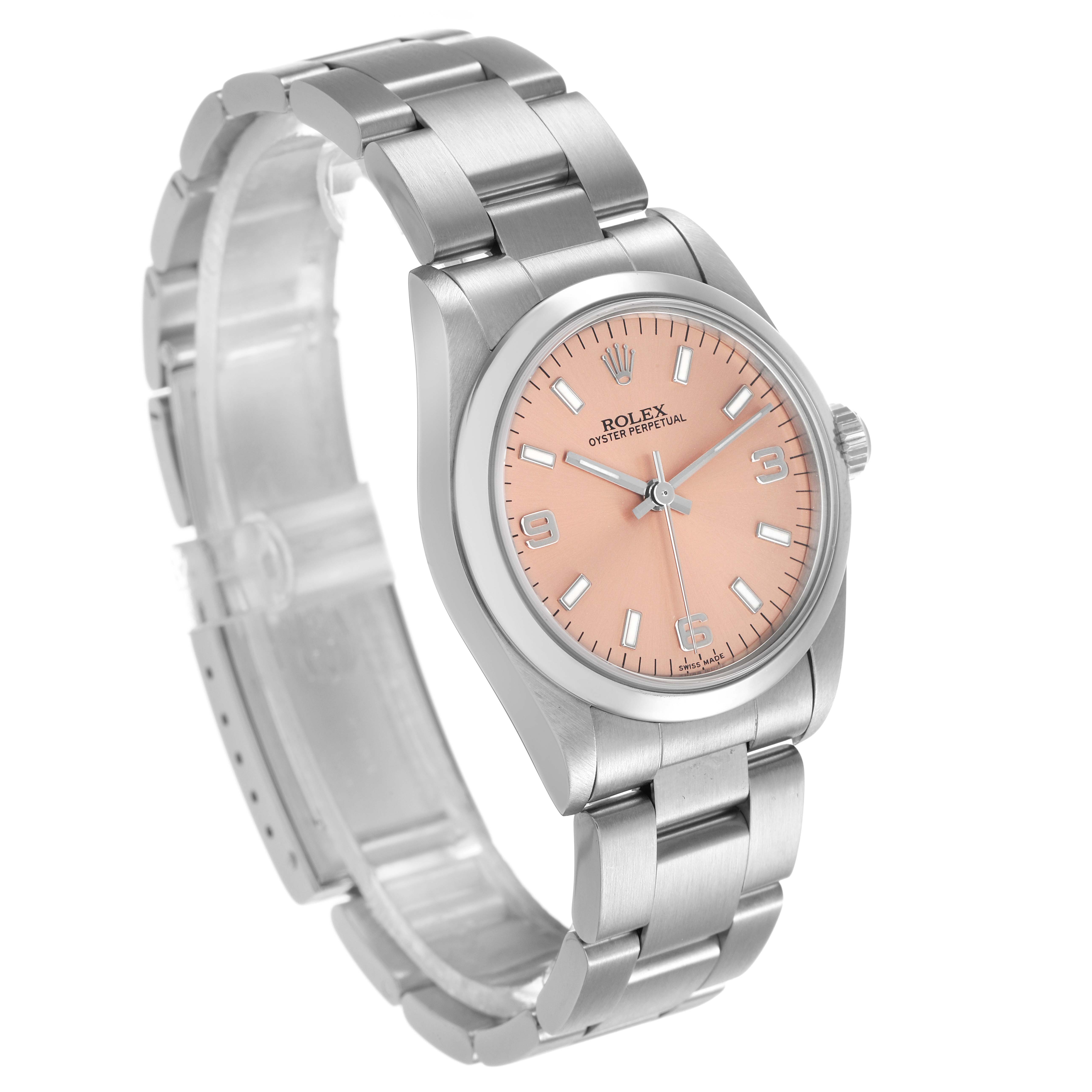 The Rolex Mid-Size 67480 Women's Stainless Steel Pink Dial watch is shown at an angled view, highlighting its pink dial, stainless steel case, and bracelet.