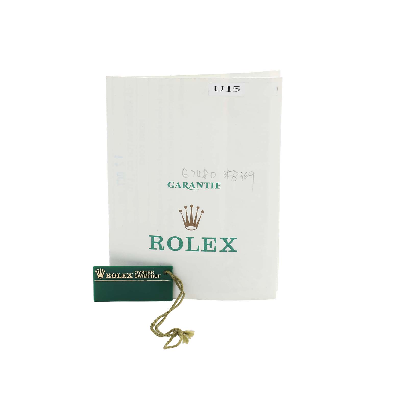 The image shows a Rolex guarantee booklet and a green Rolex Oyster Swimpruf tag, part of the Mid-Size model accessories.