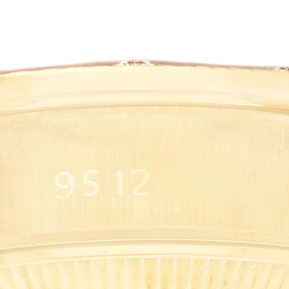 The image shows a close-up angle of the engraved serial number on the side of a Rolex President 69288G Women's Yellow Gold Black Dial 69288G Women's Yellow Gold Black Dial model.