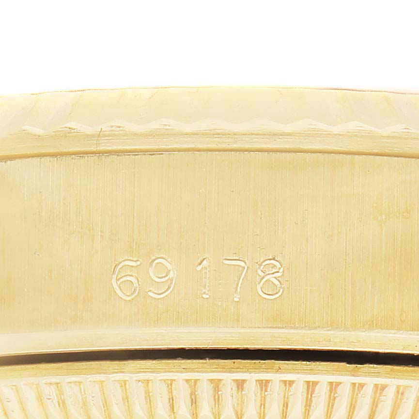 The image shows the side view of the Rolex President 69178 Women's Yellow Gold Champagne Dial model, highlighting its case with the model number engraved.