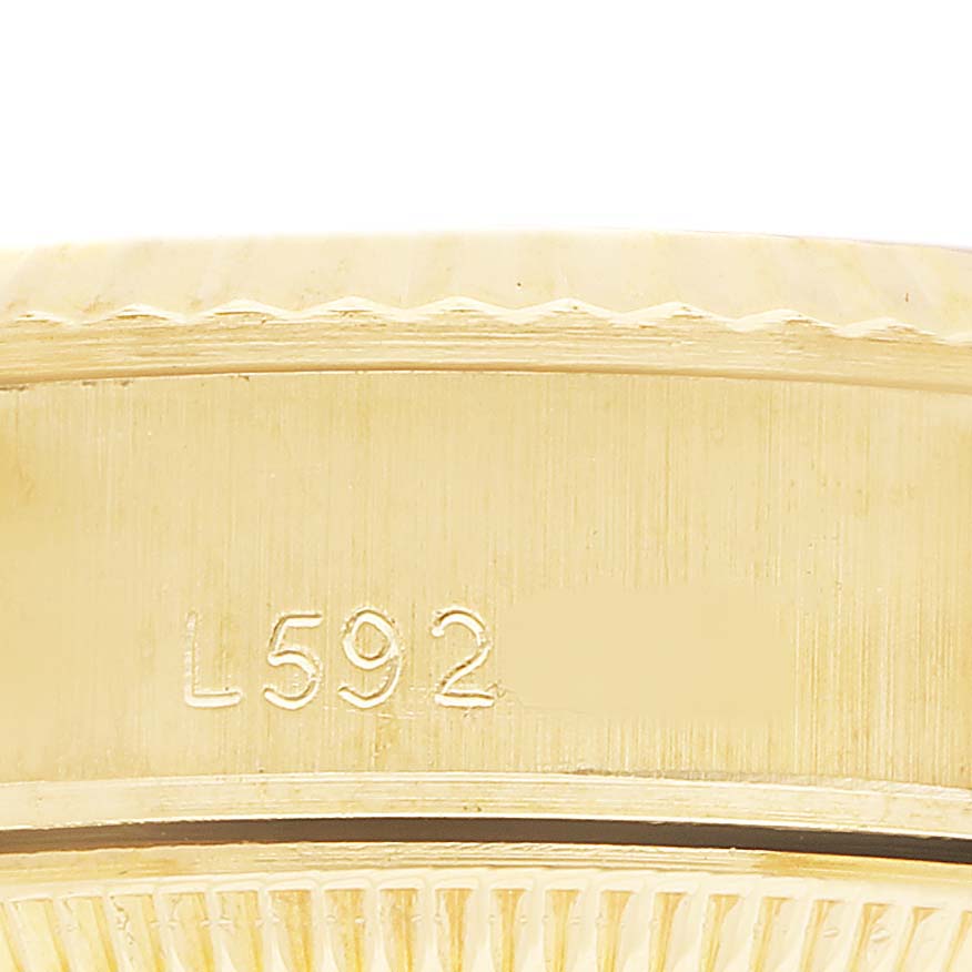 The image shows a close-up of the serial number engraved on the side of the case of a Rolex President 69178 Women's Yellow Gold Champagne Dial model.