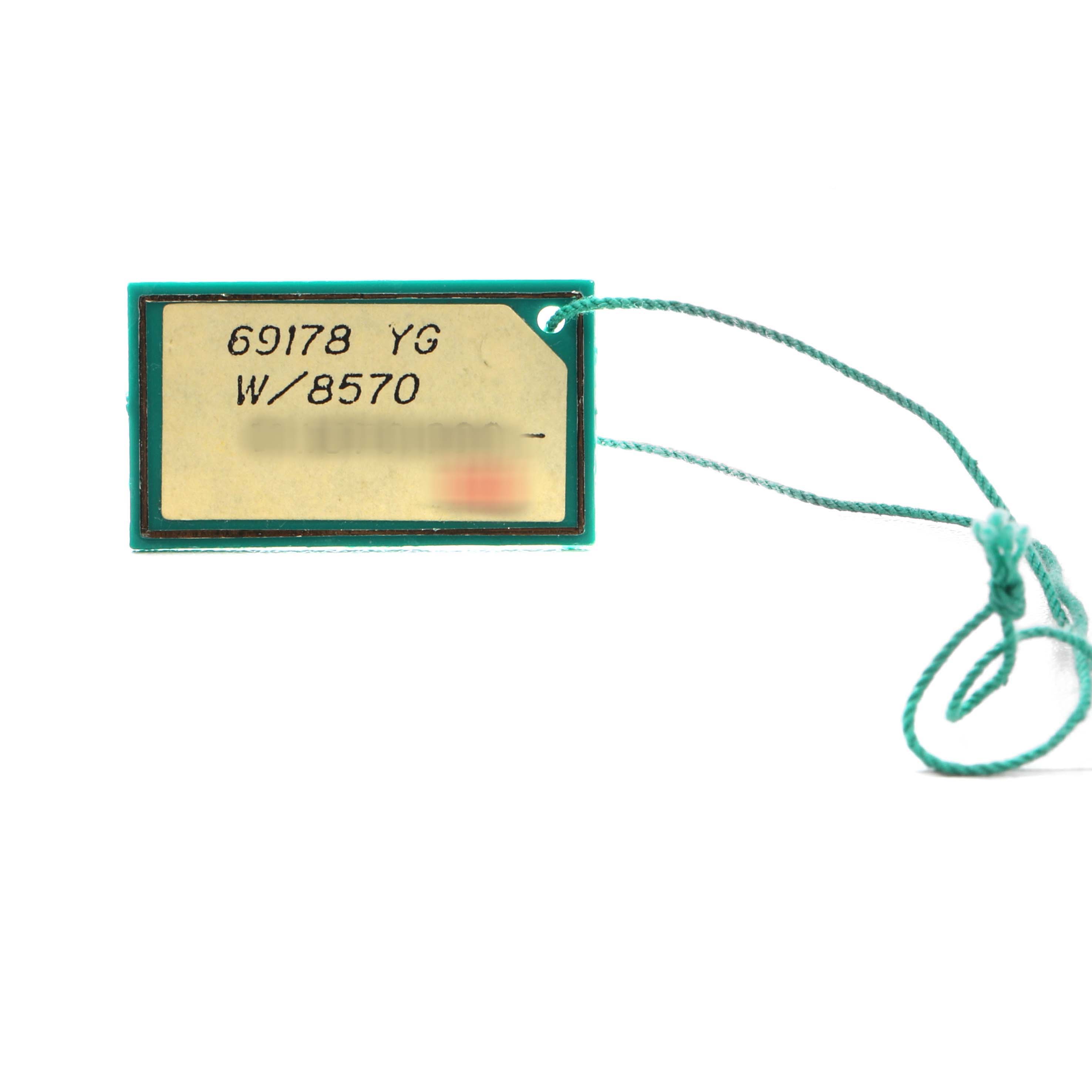 The image shows a rectangular tag with text and a string attached, related to the Rolex President 69178 Women's Yellow Gold Champagne Dial model watch.