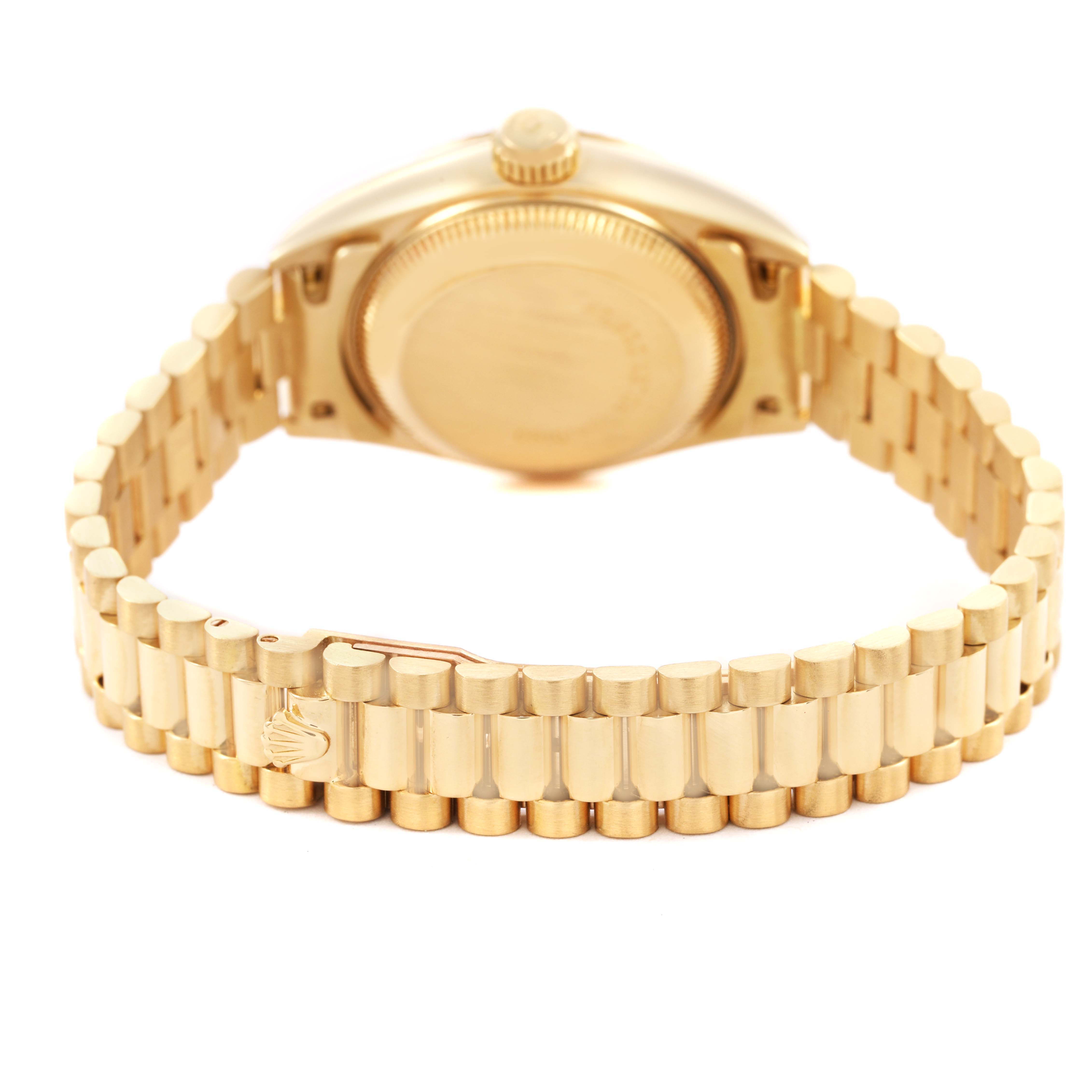 The image shows the back view and bracelet of a Rolex President 69178 Women's Yellow Gold Champagne Dial model, highlighting the clasp and case back.