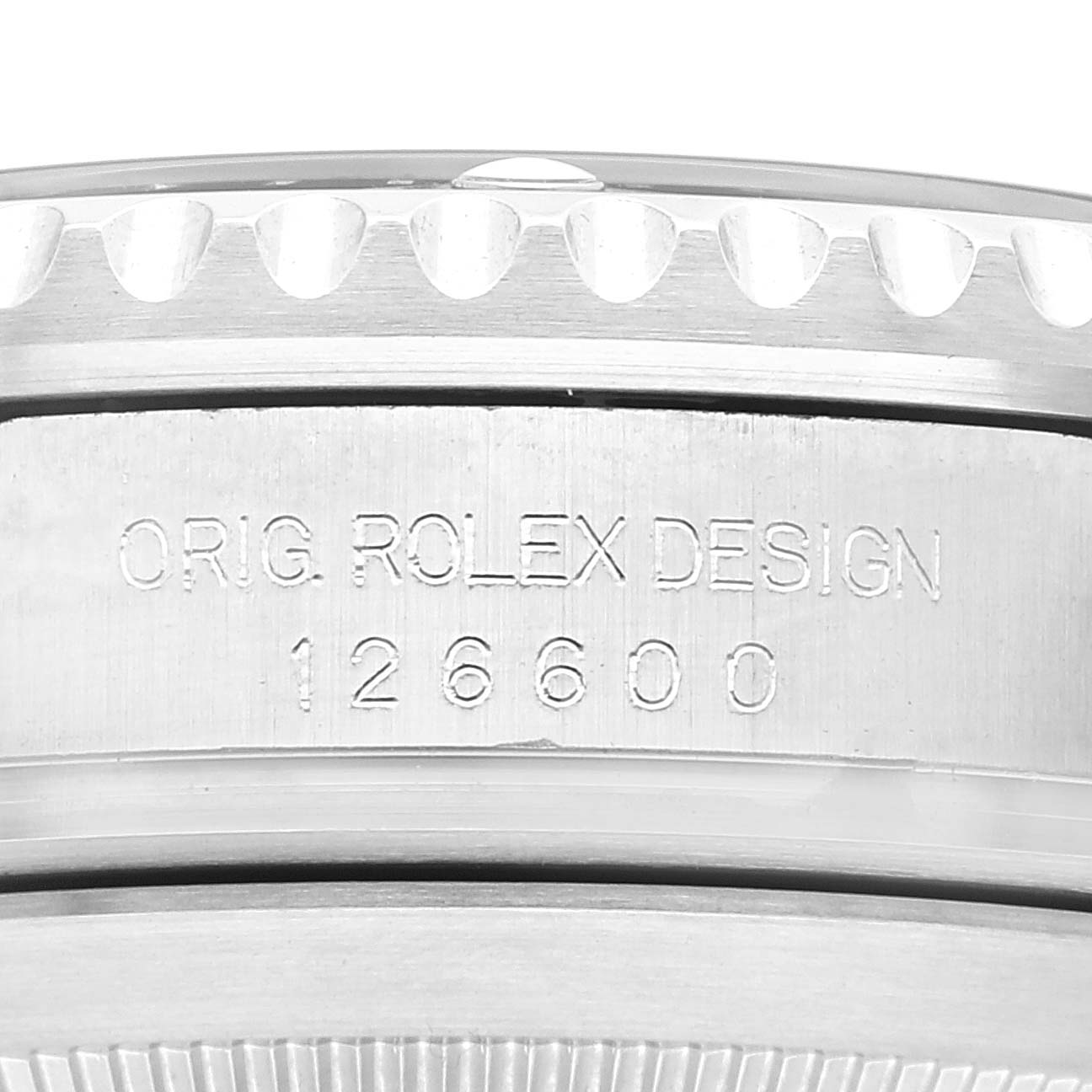 This image shows a close-up of the side of a Rolex Sea-Dweller 126600 Men
s Stainless Steel Black Dial 126600 Men
s Stainless Steel Black Dial watch case, displaying the model number 126600 and "ORIG. ROLEX DESIGN" engraving.