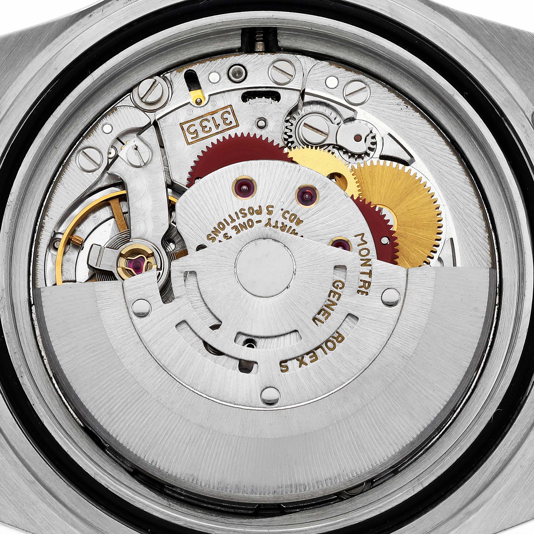 This image shows the intricate internal mechanisms of a Rolex Submariner 16613 Men's Steel and Gold (two tone) Blue Dial 16613 Men's Steel and Gold (two tone) Blue Dial watch from a rear angle, highlighting its movement parts.