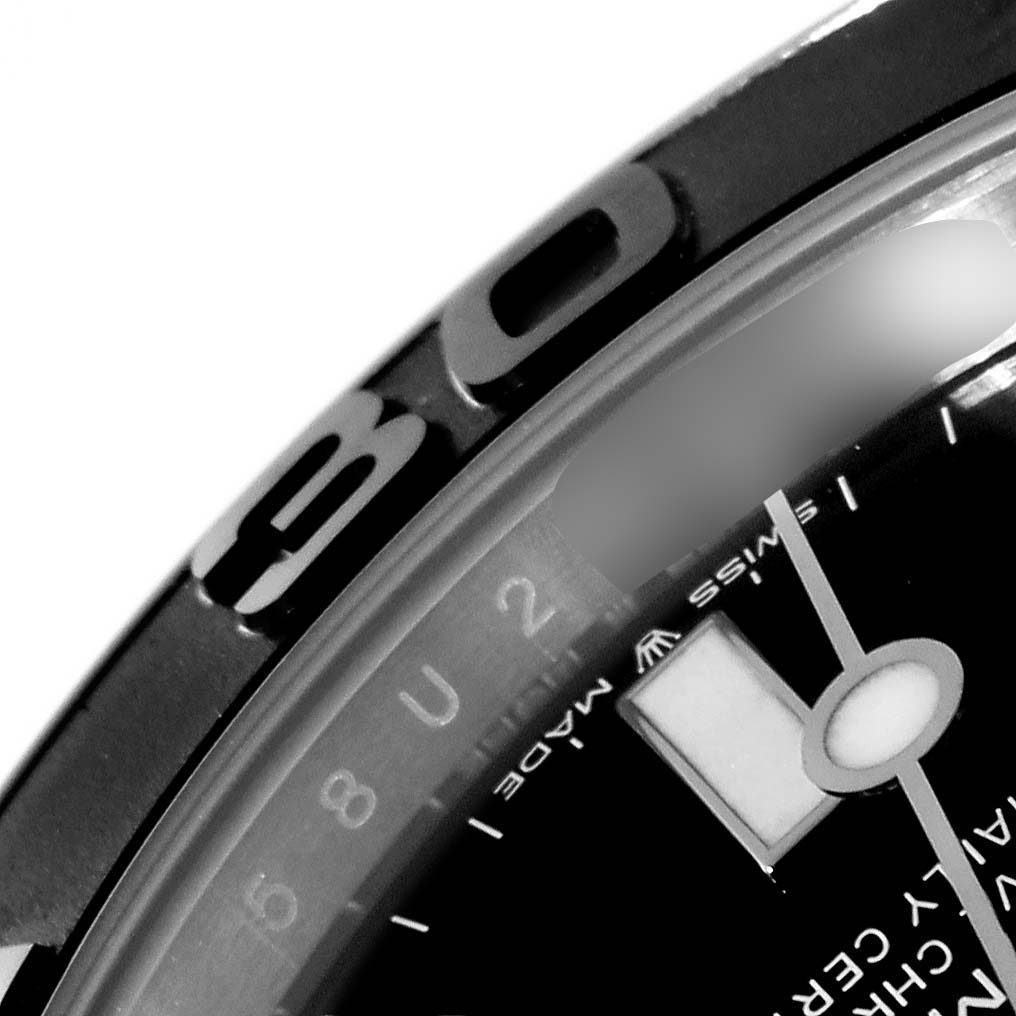 This close-up image shows the bezel, part of the face, and hour hand of a Rolex Yacht-Master 226659 Men's White Gold Black Dial 226659 Men's White Gold Black Dial watch.