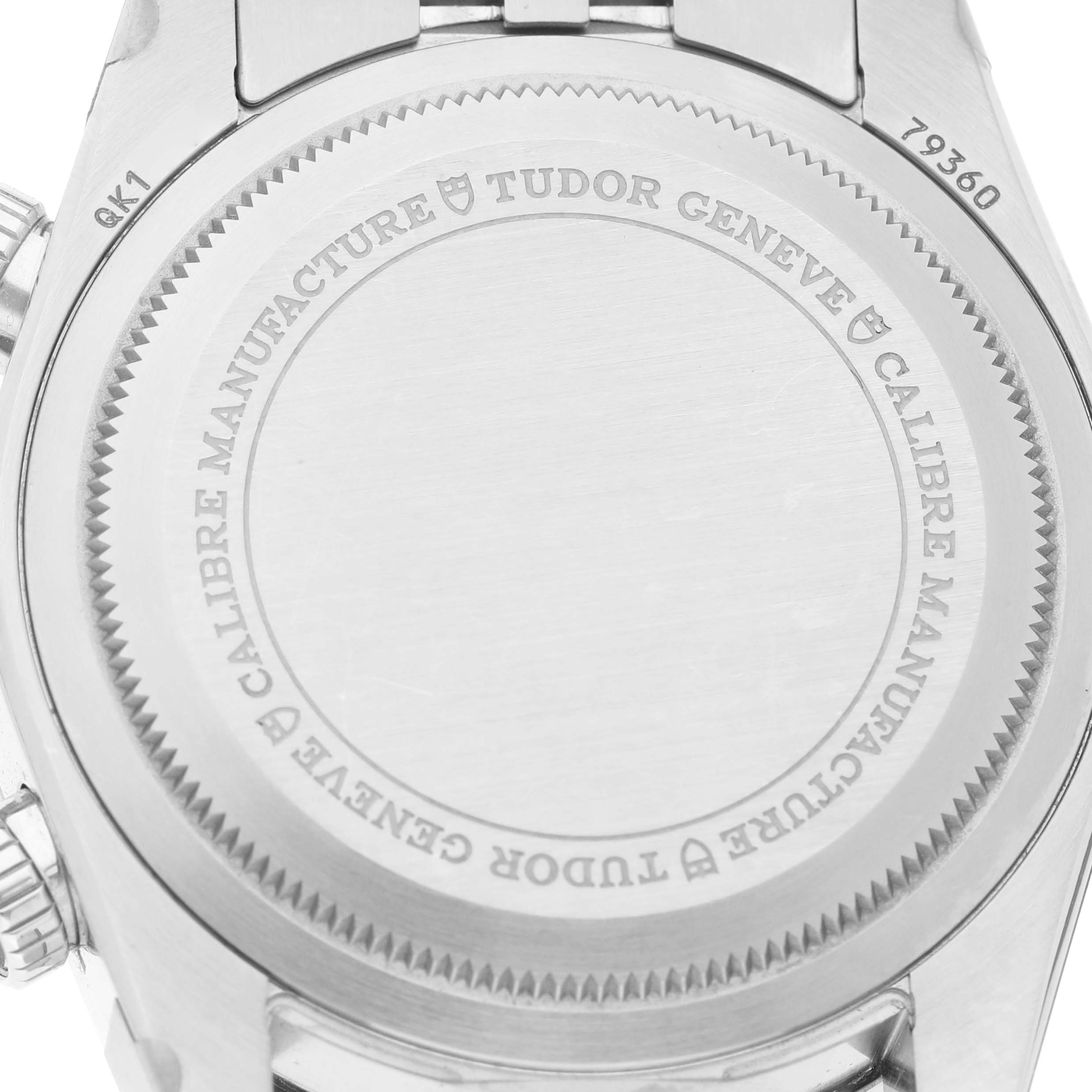 The image shows the back case of a Tudor Heritage Chrono 79360N Men's Stainless Steel Blue Dial watch, displaying engraved details and the case number.