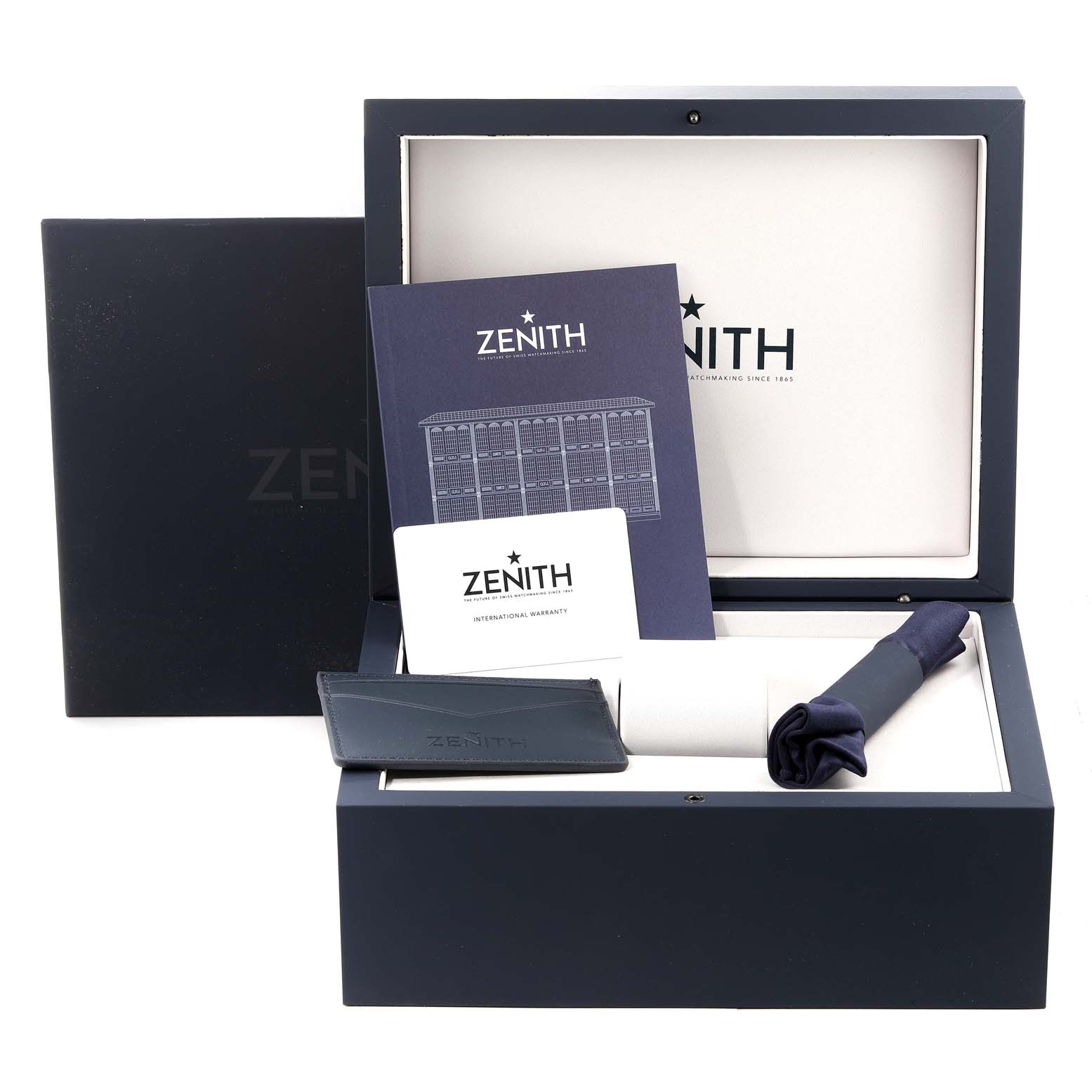 The image shows the packaging and accessories, including a booklet, card wallet, and cloth for the Zenith Chronomaster 03.3105.3600 Men's Stainless Steel Blue Dial 03.3105.3600 Men's Stainless Steel Blue Dial watch.