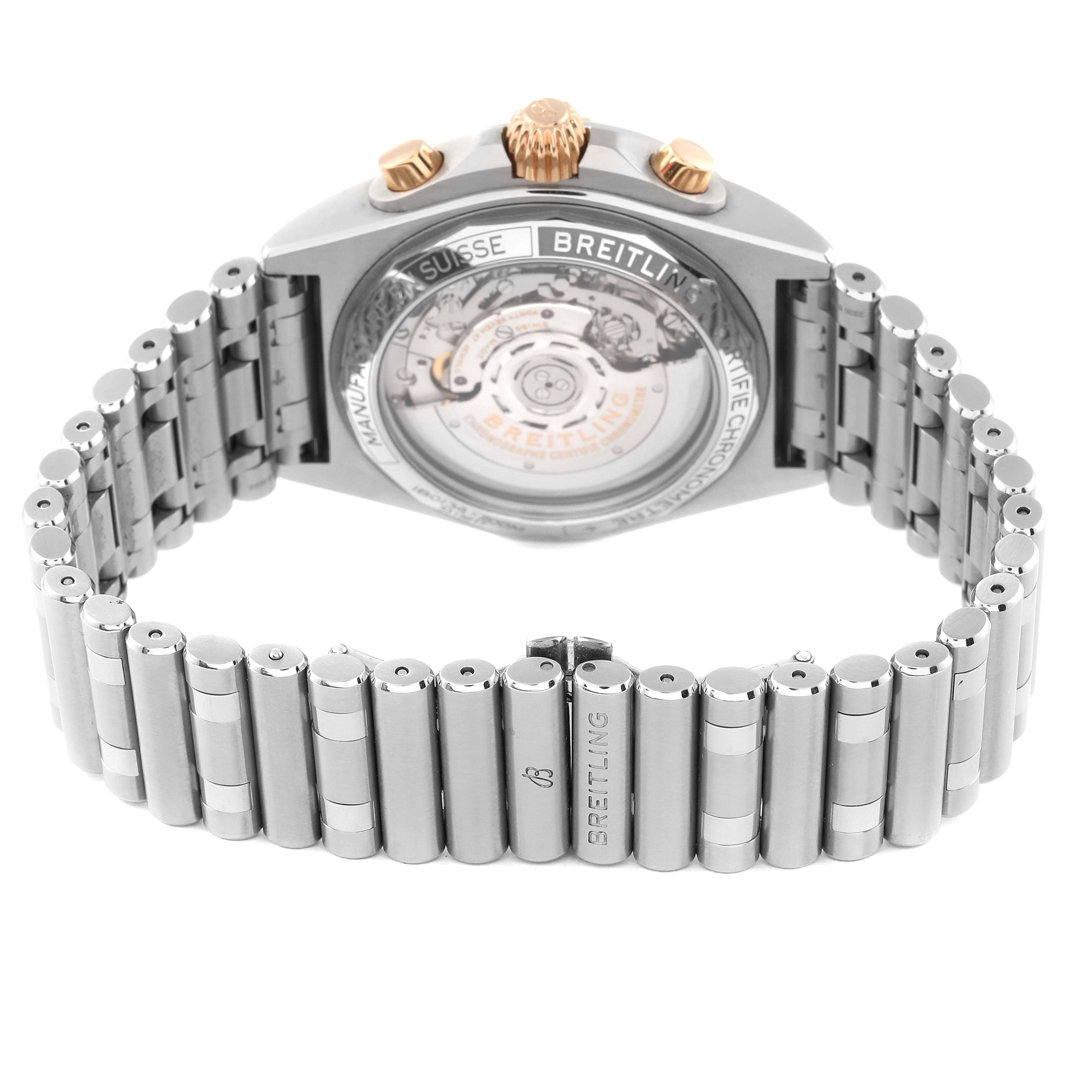 The image shows the back view of a Breitling Chronomat IB0134 Men
s Stainless Steel Silver Dial IB0134 Men
s Stainless Steel Silver Dial watch, highlighting the stainless steel bracelet and exposed movement.