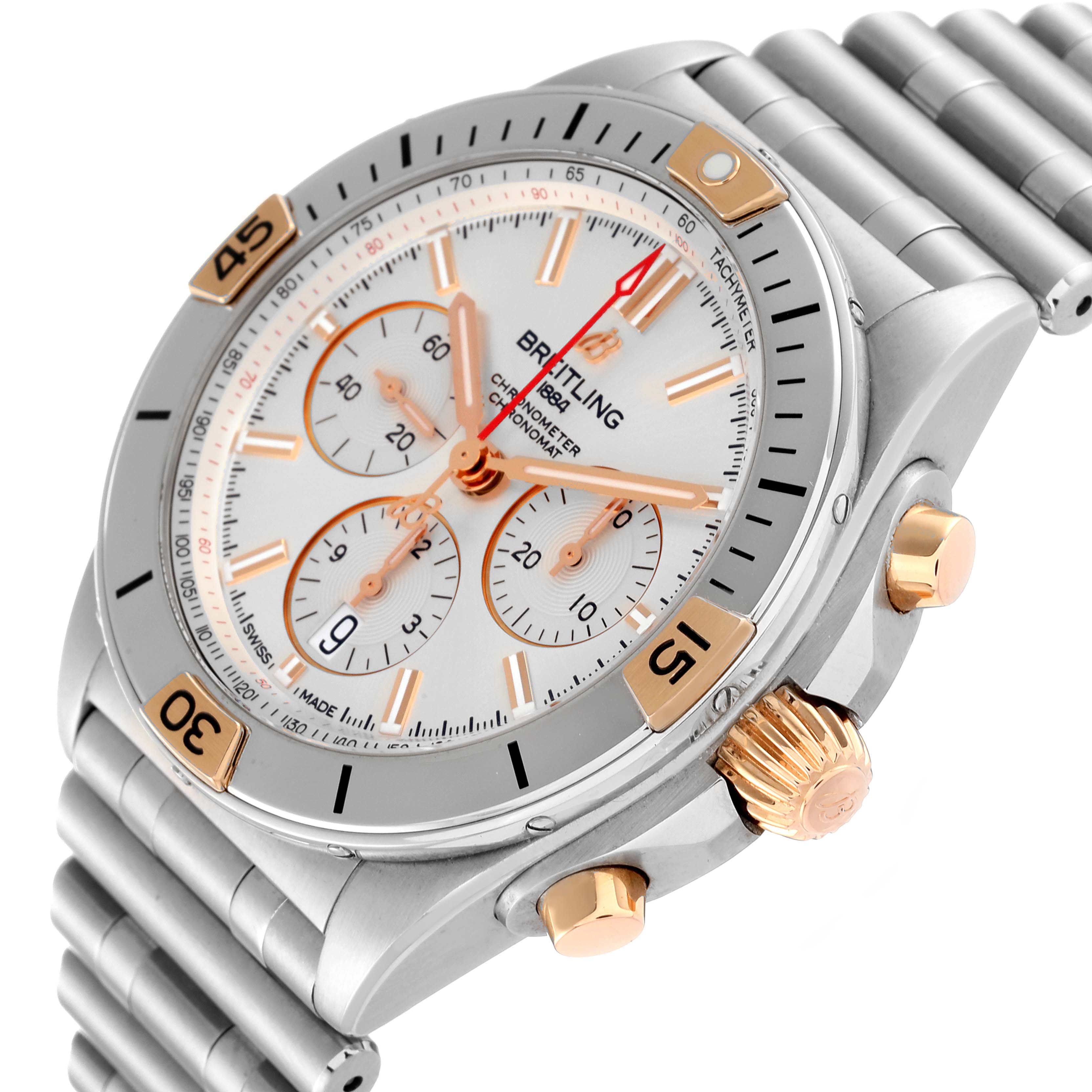 The image shows a side view angle of the Breitling Chronomat IB0134 Men
s Stainless Steel Silver Dial IB0134 Men
s Stainless Steel Silver Dial watch, displaying its face, bezel, crown, and chronograph buttons.