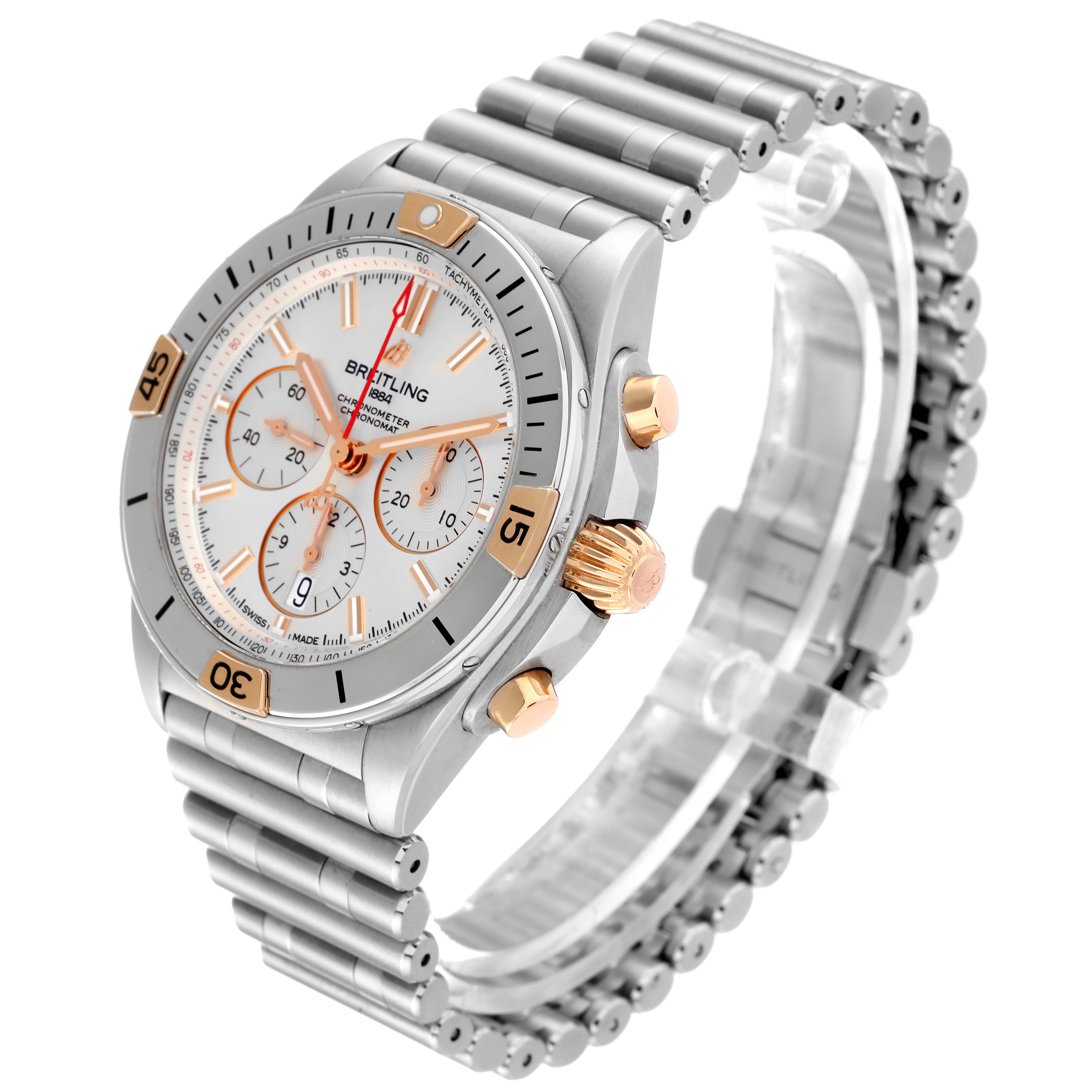 The Breitling Chronomat IB0134 Men
s Stainless Steel Silver Dial IB0134 Men
s Stainless Steel Silver Dial watch is shown from an angled side view, displaying the face, bezel, crown, and part of the bracelet.