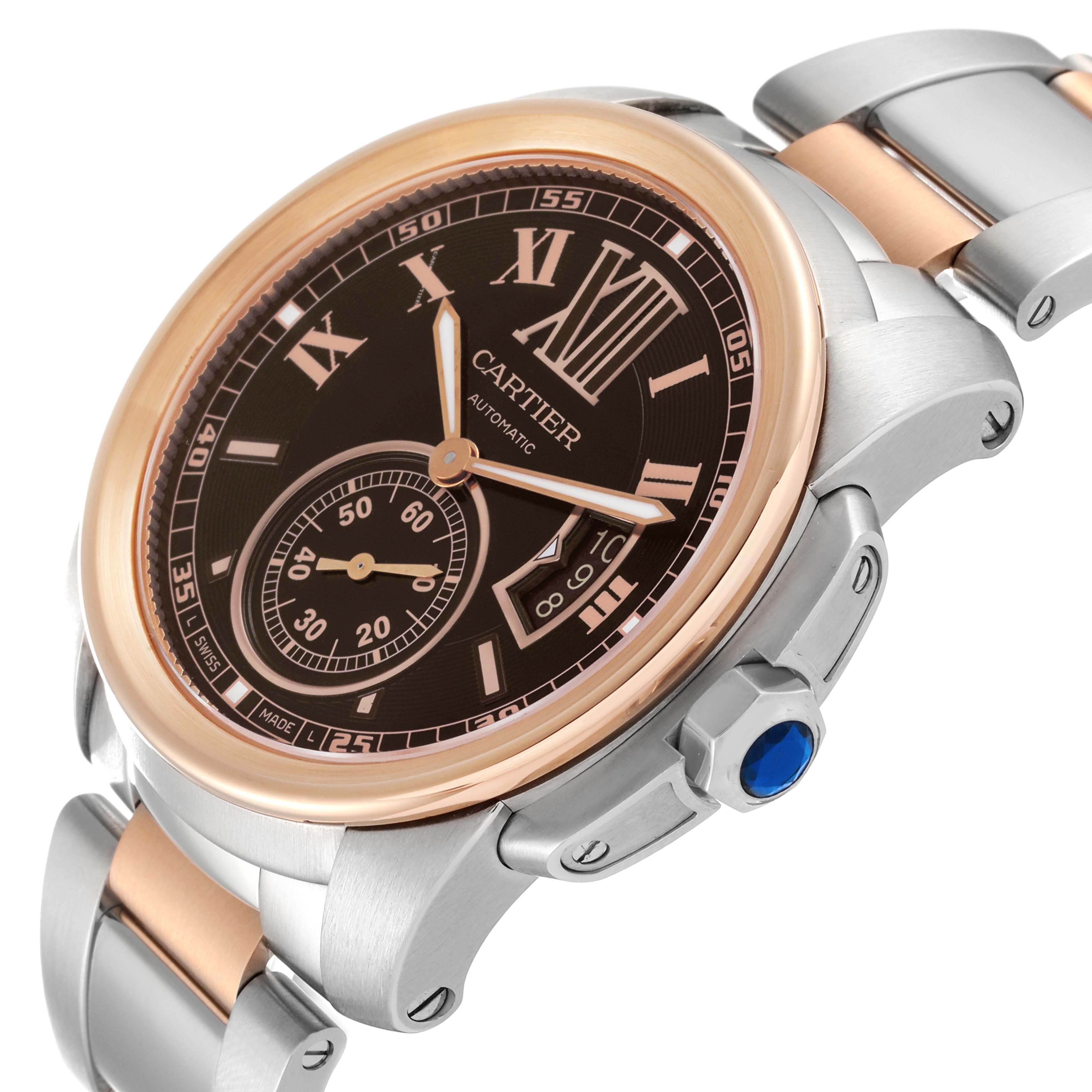 The image shows a Calibre de Cartier watch by Cartier from an angled view, highlighting the bezel, dial, crown, and bracelet.