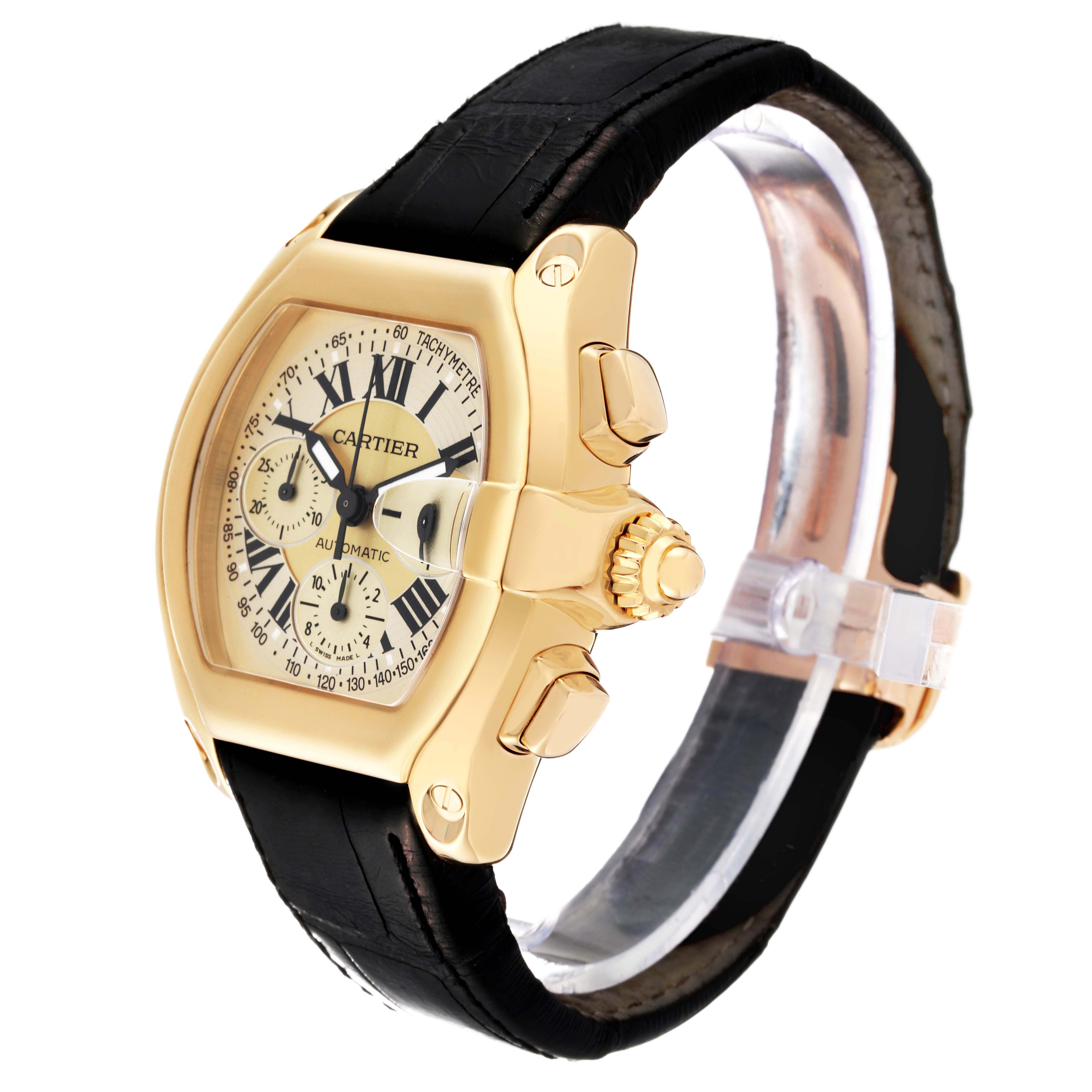 The image shows a Cartier Roadster W62021Y3 Men's Yellow Gold Champagne Dial W62021Y3 Men's Yellow Gold Champagne Dial watch from a front-side angle, highlighting the dial, crown, and leather strap.