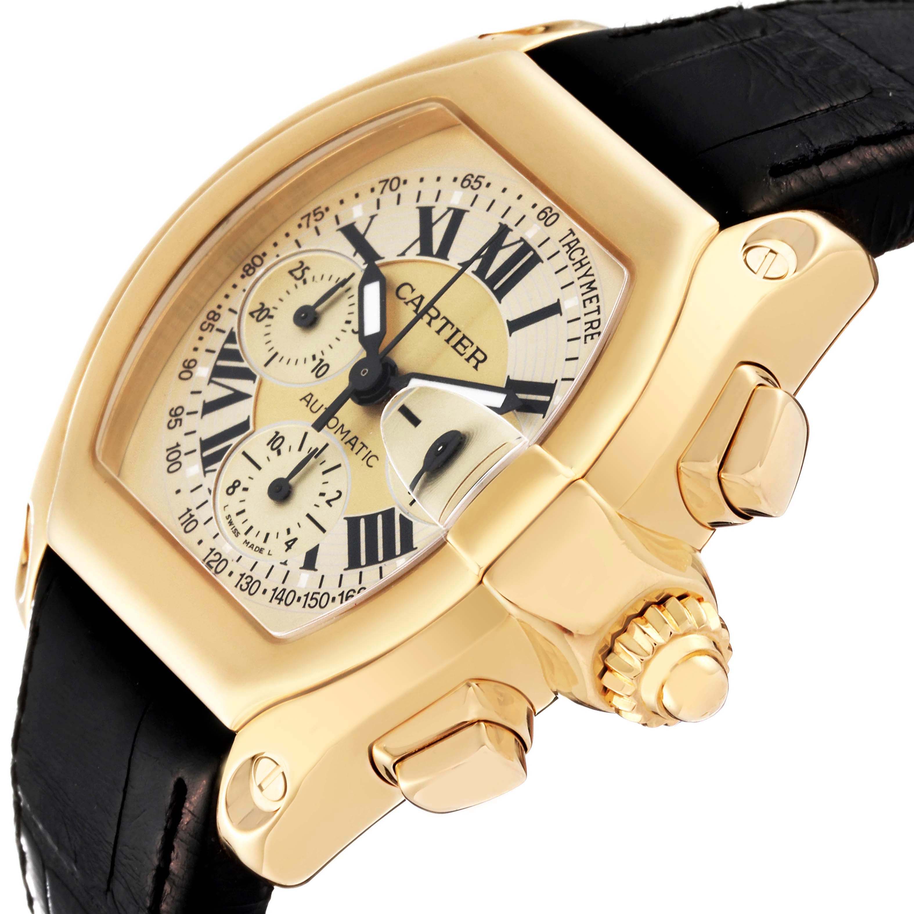 The image shows a close-up, angled view of a Cartier Roadster W62021Y3 Men's Yellow Gold Champagne Dial W62021Y3 Men's Yellow Gold Champagne Dial watch, highlighting the gold case, crown, and dial details.