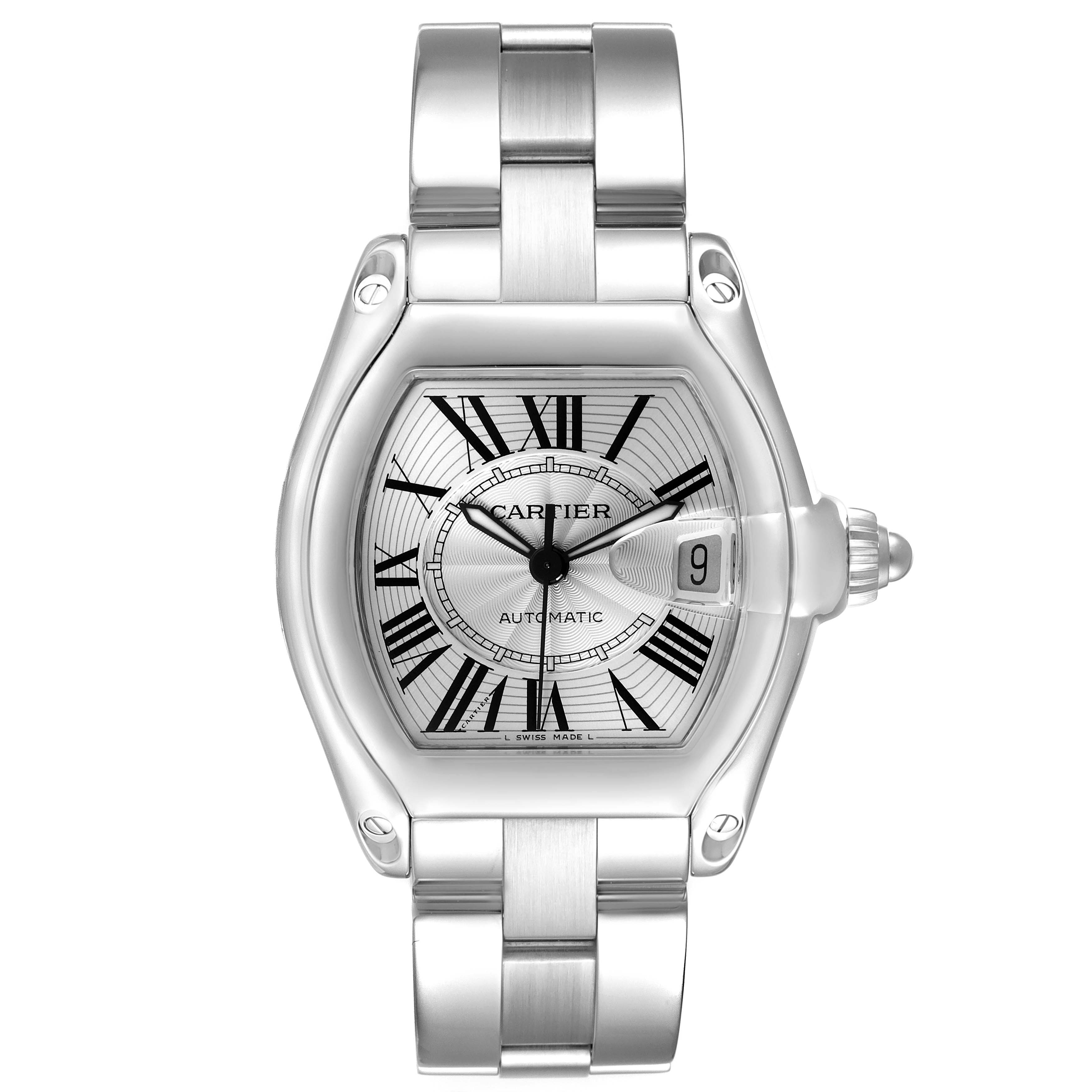 The Cartier Roadster model W62025V3 men
s watch is shown from a front angle, highlighting the silver dial, Roman numerals, date window, and metal bracelet.