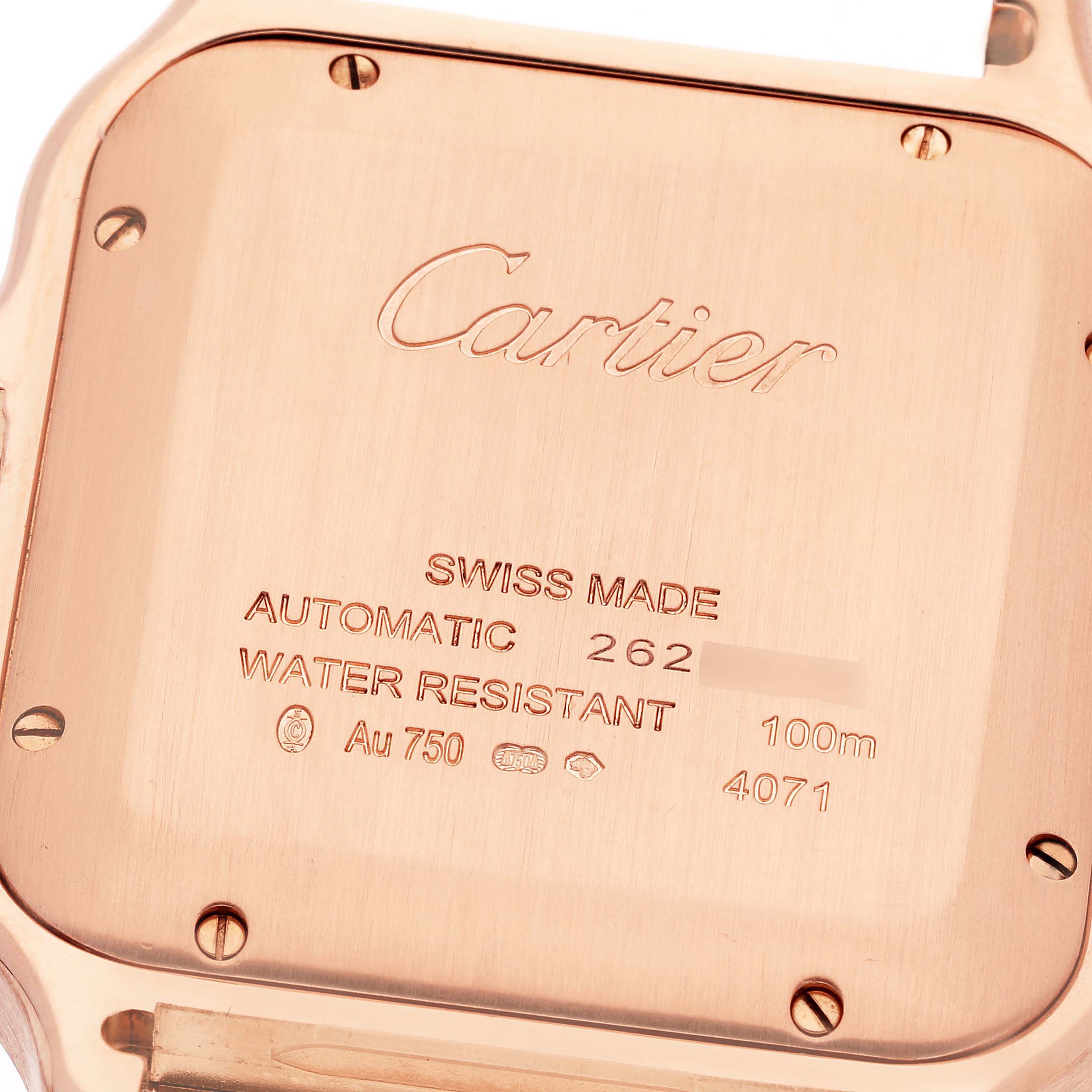The image shows the case back of a Cartier Santos WGSA0011 Men's Rose Gold Silver Dial WGSA0011 Men's Rose Gold Silver Dial watch, displaying brand markings and specifications.
