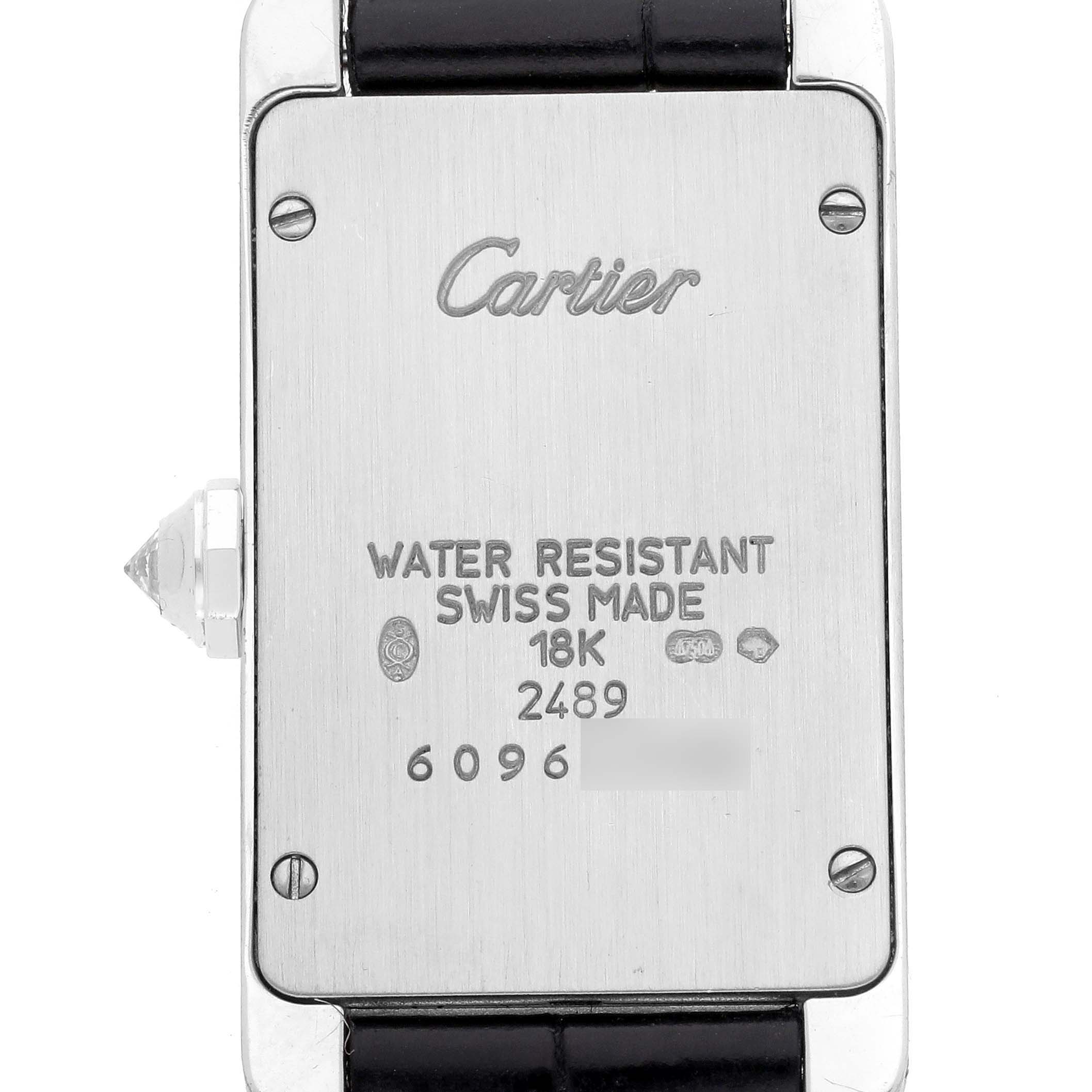 This is the case back of the Cartier Tank Americaine WB704431 Women's White Gold Silver Dial WB704431 Women's White Gold Silver Dial watch, showing details like "Swiss Made," "18K," and "Water Resistant."