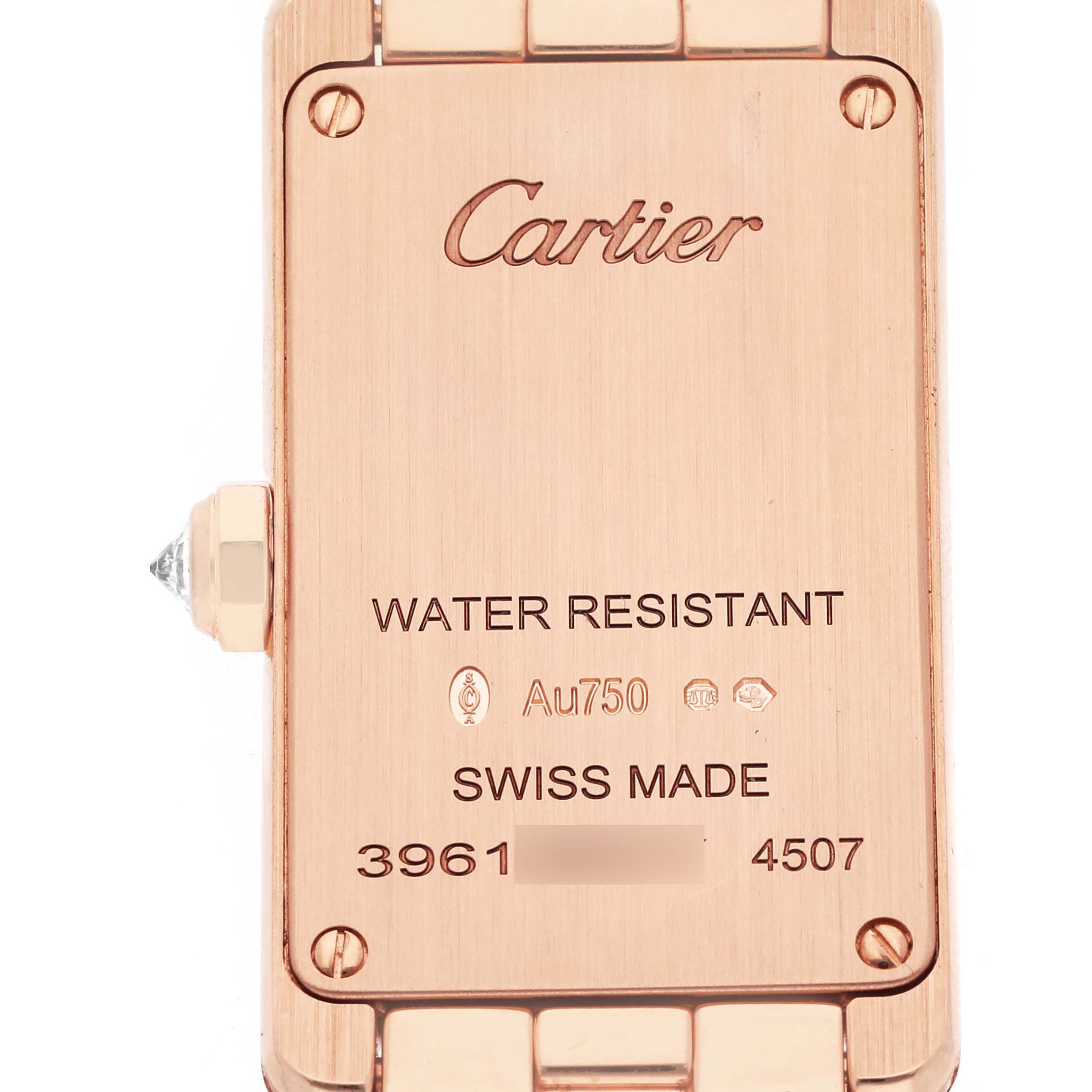 The image shows the back of a Cartier Tank Américaine model WJTA0044 men's watch, highlighting inscriptions and the crown on the side.