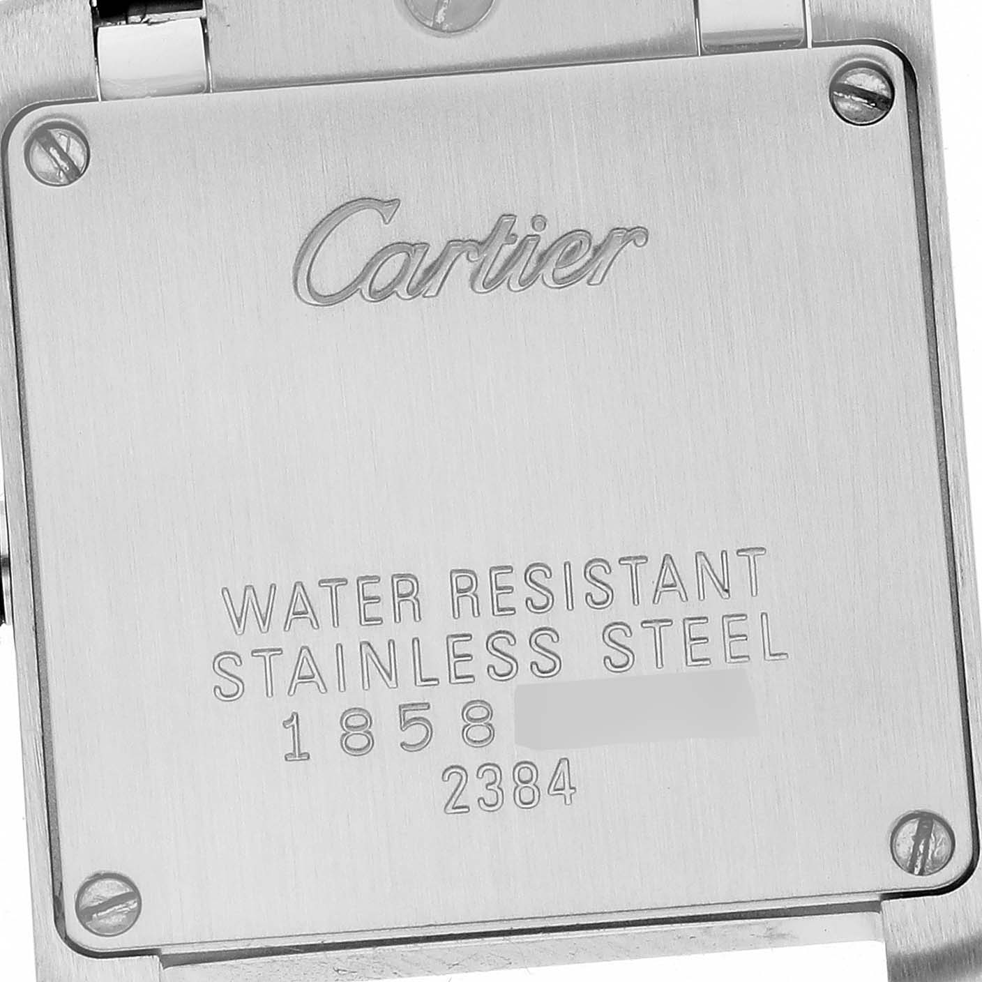 This image shows the stainless steel case back of the Cartier Tank Francaise W51007Q4 Women's Stainless Steel Silver Dial W51007Q4 Women's Stainless Steel Silver Dial watch at a close-up angle.