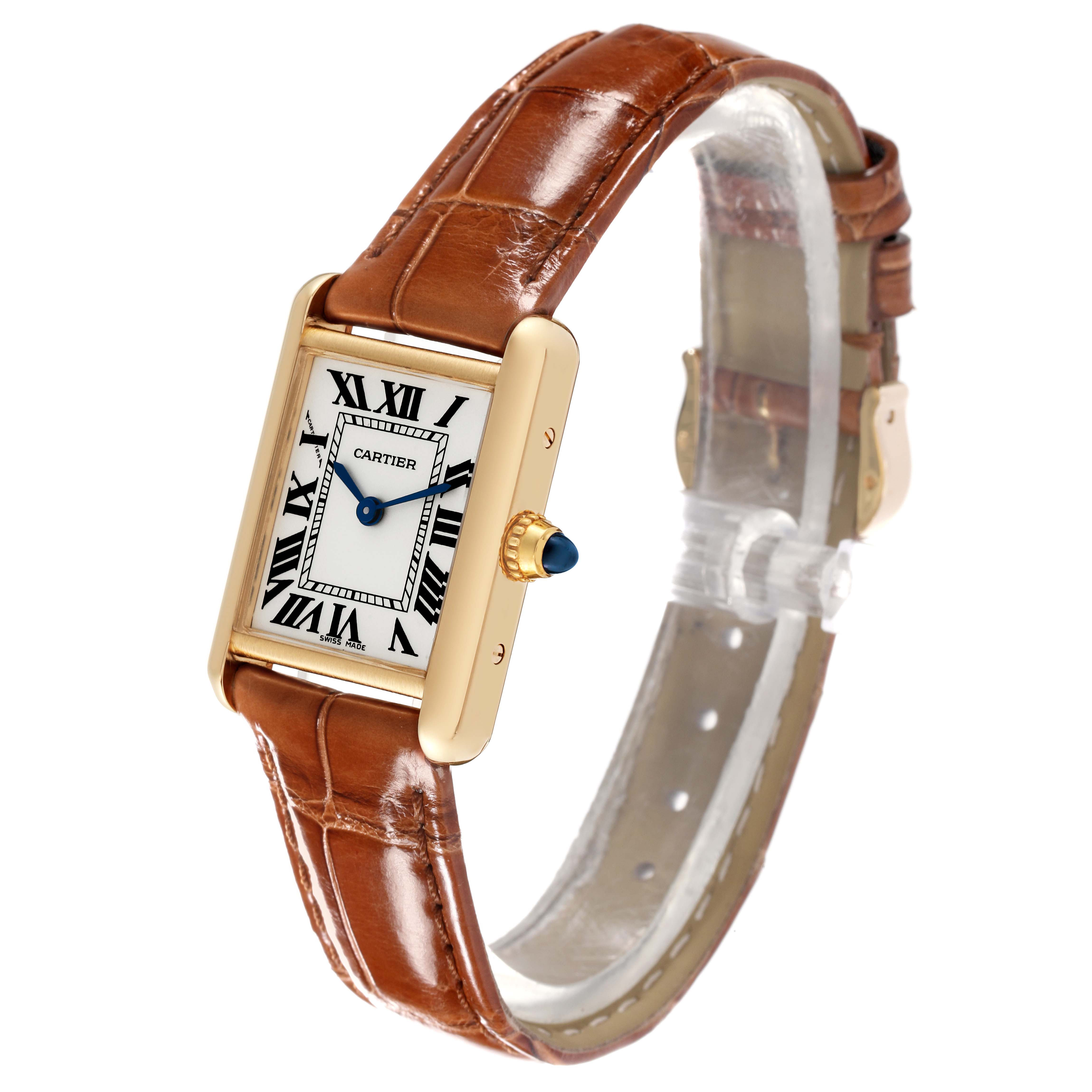 The Cartier Tank Louis W1529856 Men's Yellow Gold Silver Dial W1529856 Men's Yellow Gold Silver Dial watch is shown at an angle displaying the brown leather strap, rectangular gold case, and white dial with Roman numerals.