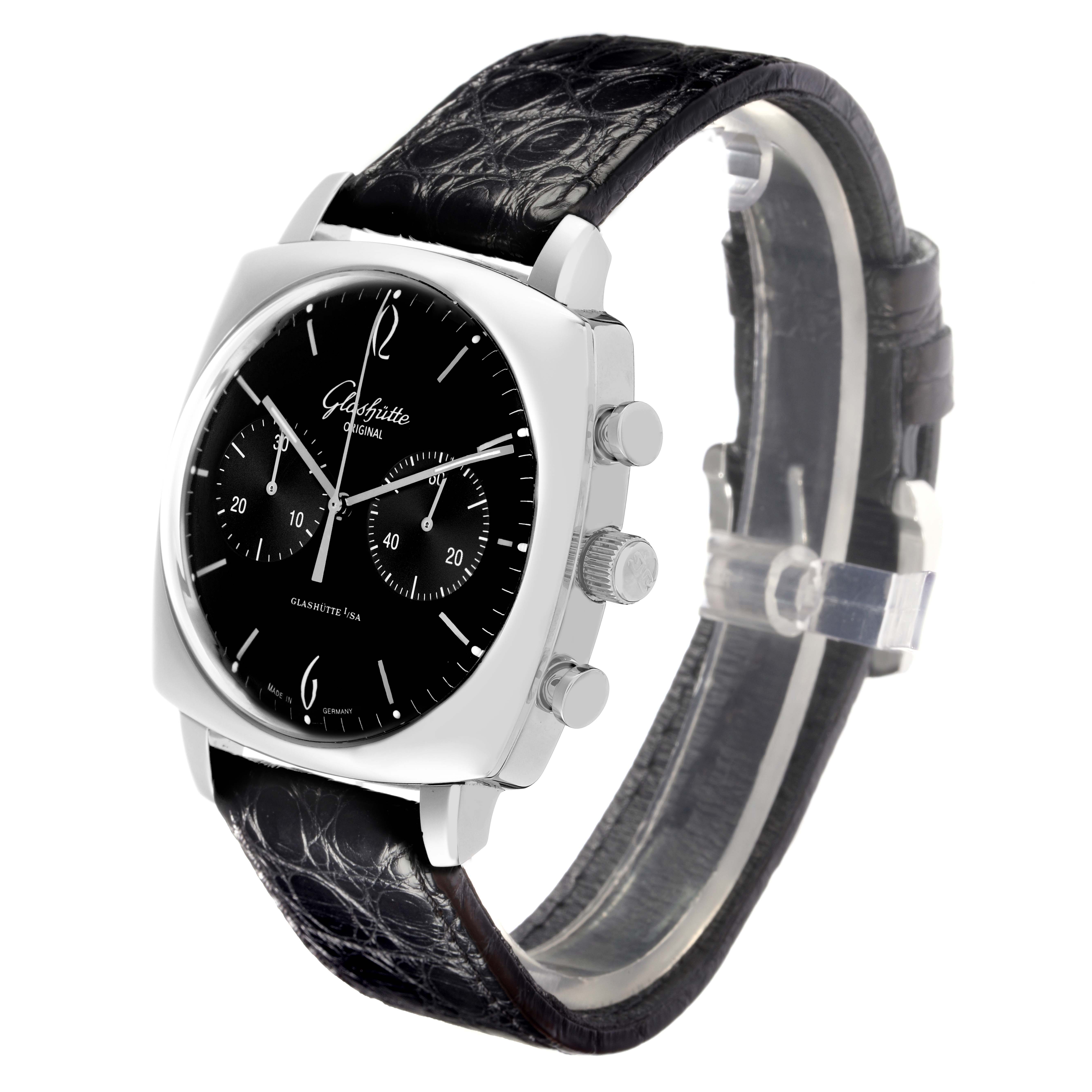 The Glashütte Senator 1-39-34-02-32-04 is shown at an angled view highlighting the black dial, leather strap, and side pushers.