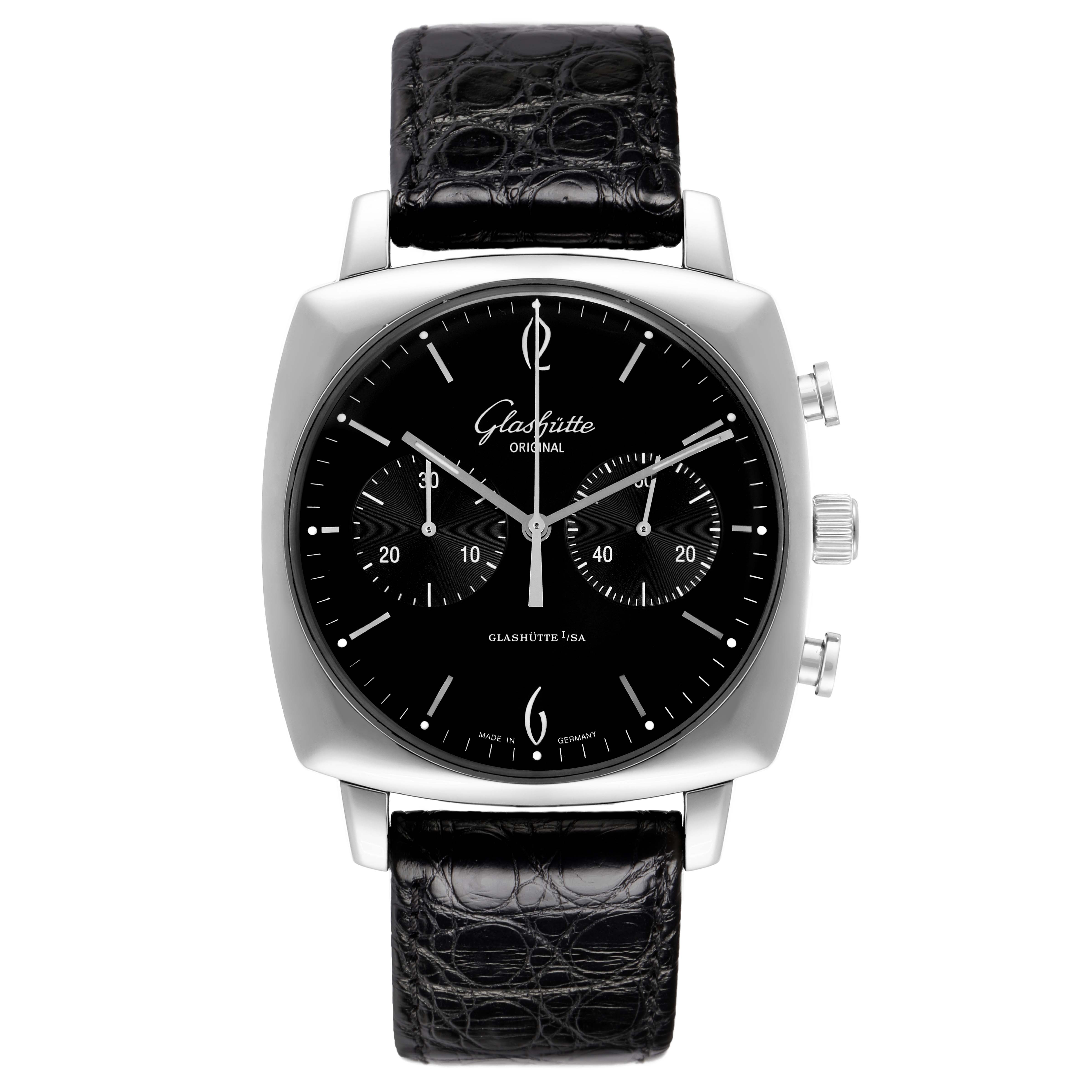 The Glashütte Senator model 1-39-34-02-32-04 is shown from a front angle, displaying the black dial, three subdials, silver markers, and a black leather strap.