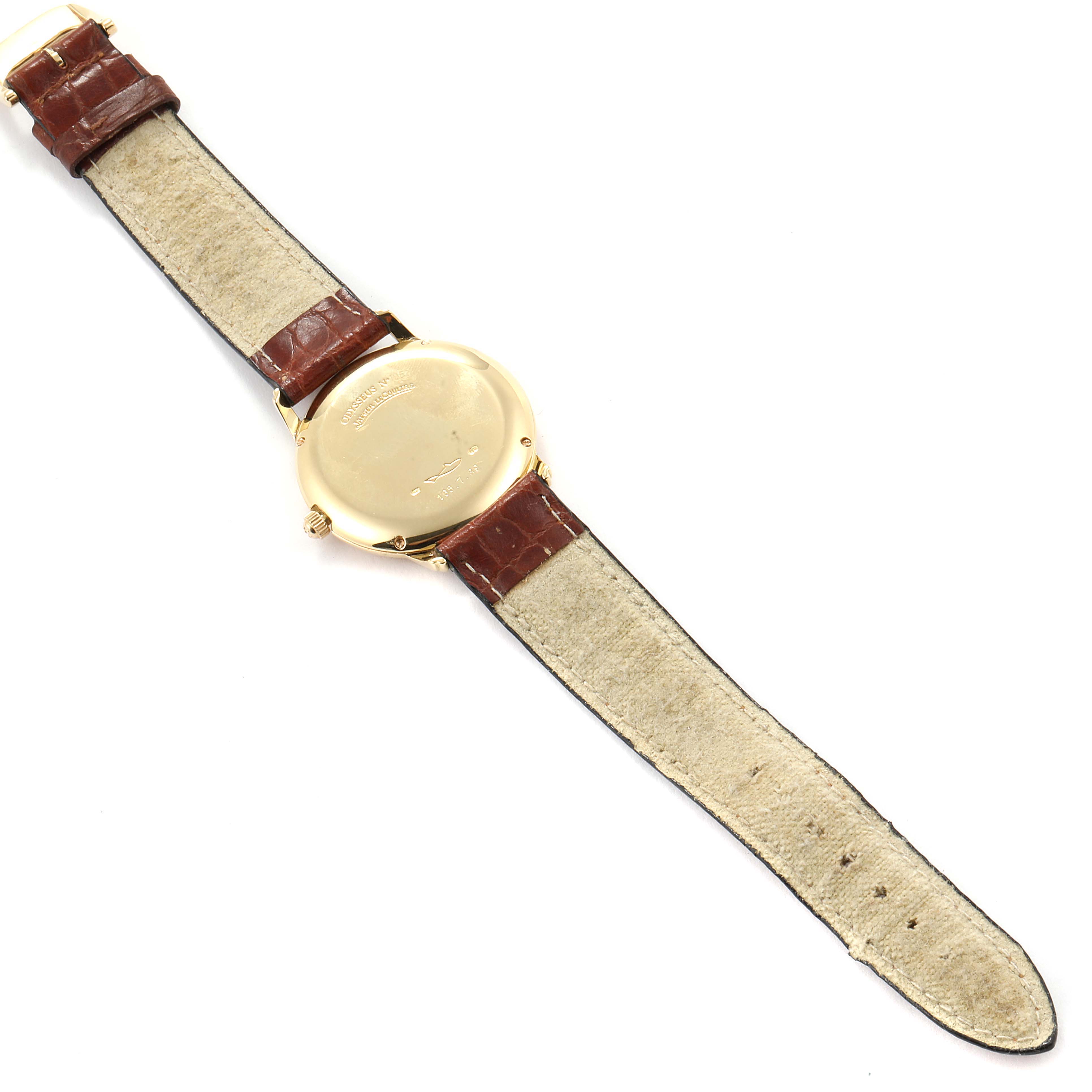 The image shows the back view of a Vintage Jaeger LeCoultre watch, highlighting the watch case and brown leather strap.