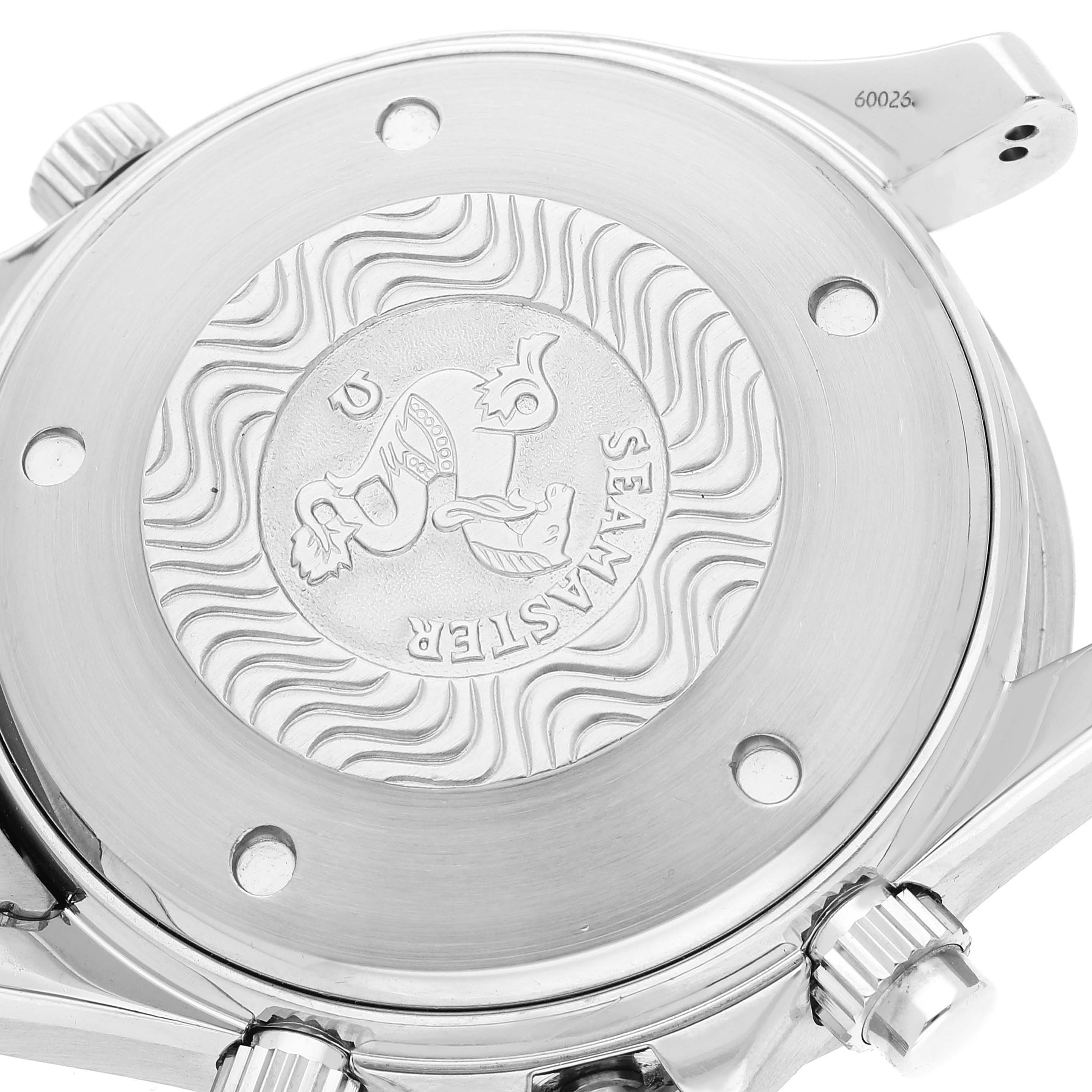 The image shows the backside and crown of an Omega Seamaster 2599.80.00 Men's Stainless Steel Blue Dial 2599.80.00 Men's Stainless Steel Blue Dial watch, highlighting the emblem and wave pattern.