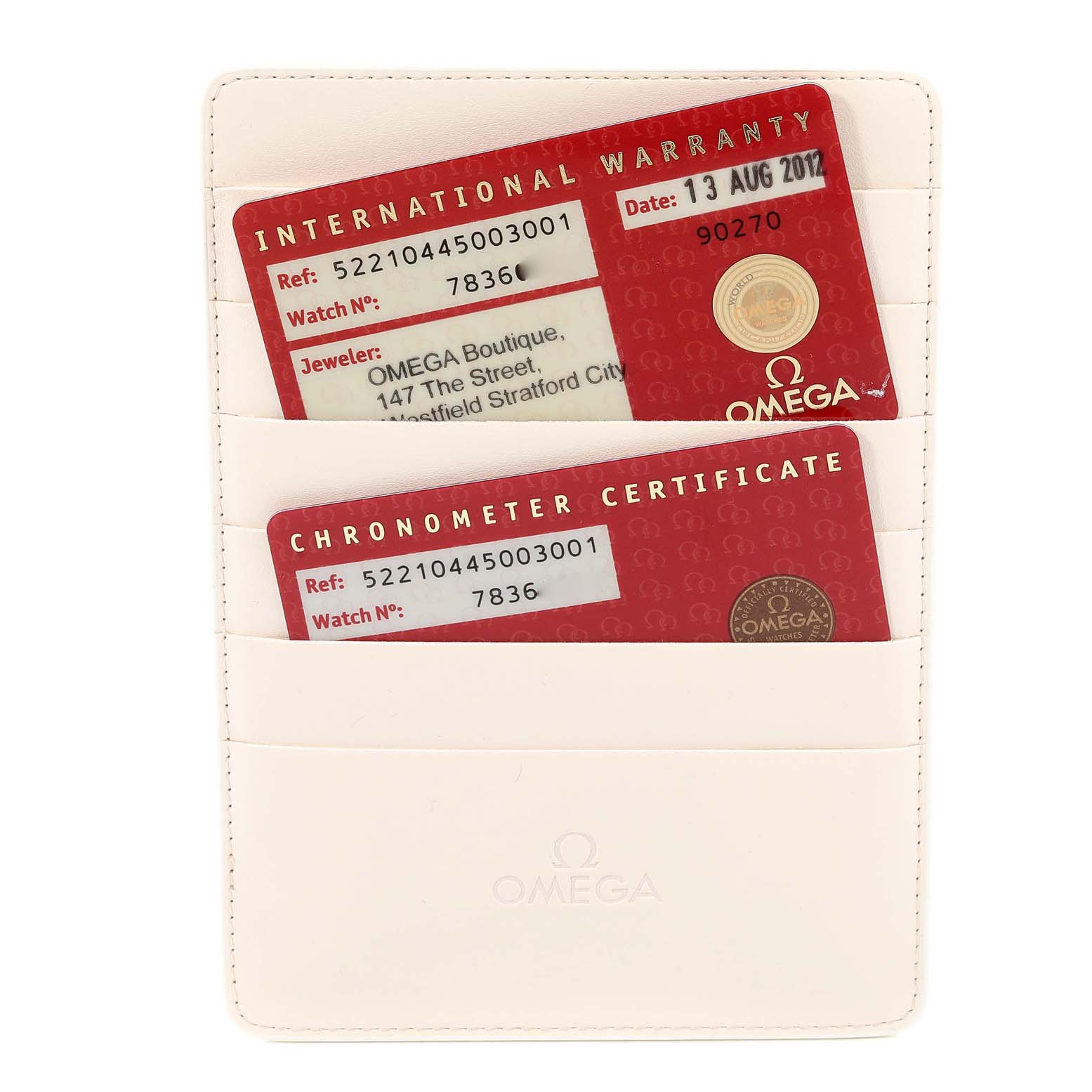 The image shows the International Warranty and Chronometer Certificate cards for the Omega Aqua Terra 522.10.44.50.03.001 Men's Stainless Steel Blue Dial 522.10.44.50.03.001 Men's Stainless Steel Blue Dial model, in a white Omega cardholder.