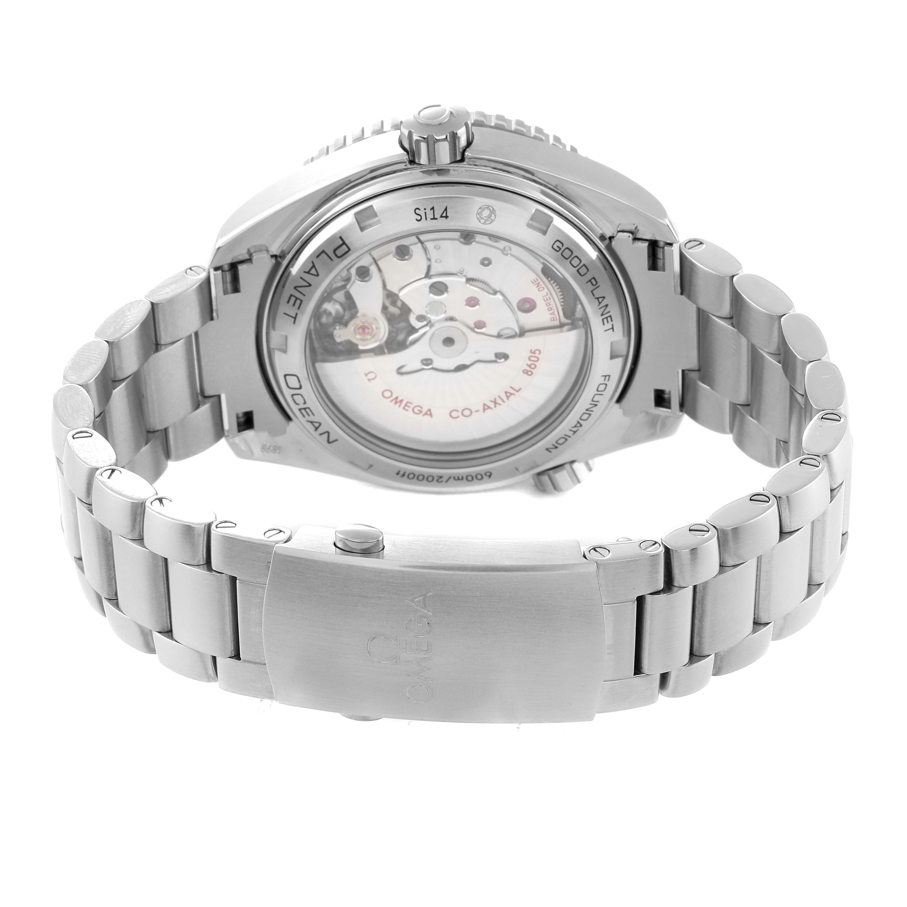 The image shows the back view of an Omega Planet Ocean 232.30.44.22.03.001 Men's Stainless Steel Blue Dial 232.30.44.22.03.001 Men's Stainless Steel Blue Dial watch, highlighting the transparent case back and metal bracelet.