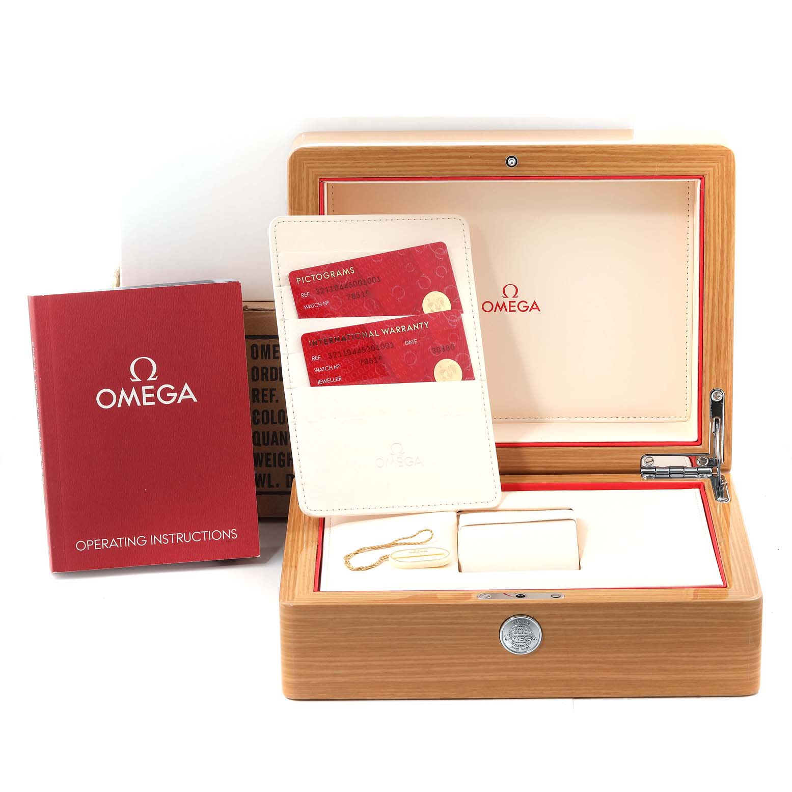 The image shows the packaging, instruction manual, warranty cards, and box of an Omega Speedmaster 321.10.44.50.01.001 Men's Stainless Steel Black Dial 321.10.44.50.01.001 Men's Stainless Steel Black Dial watch.