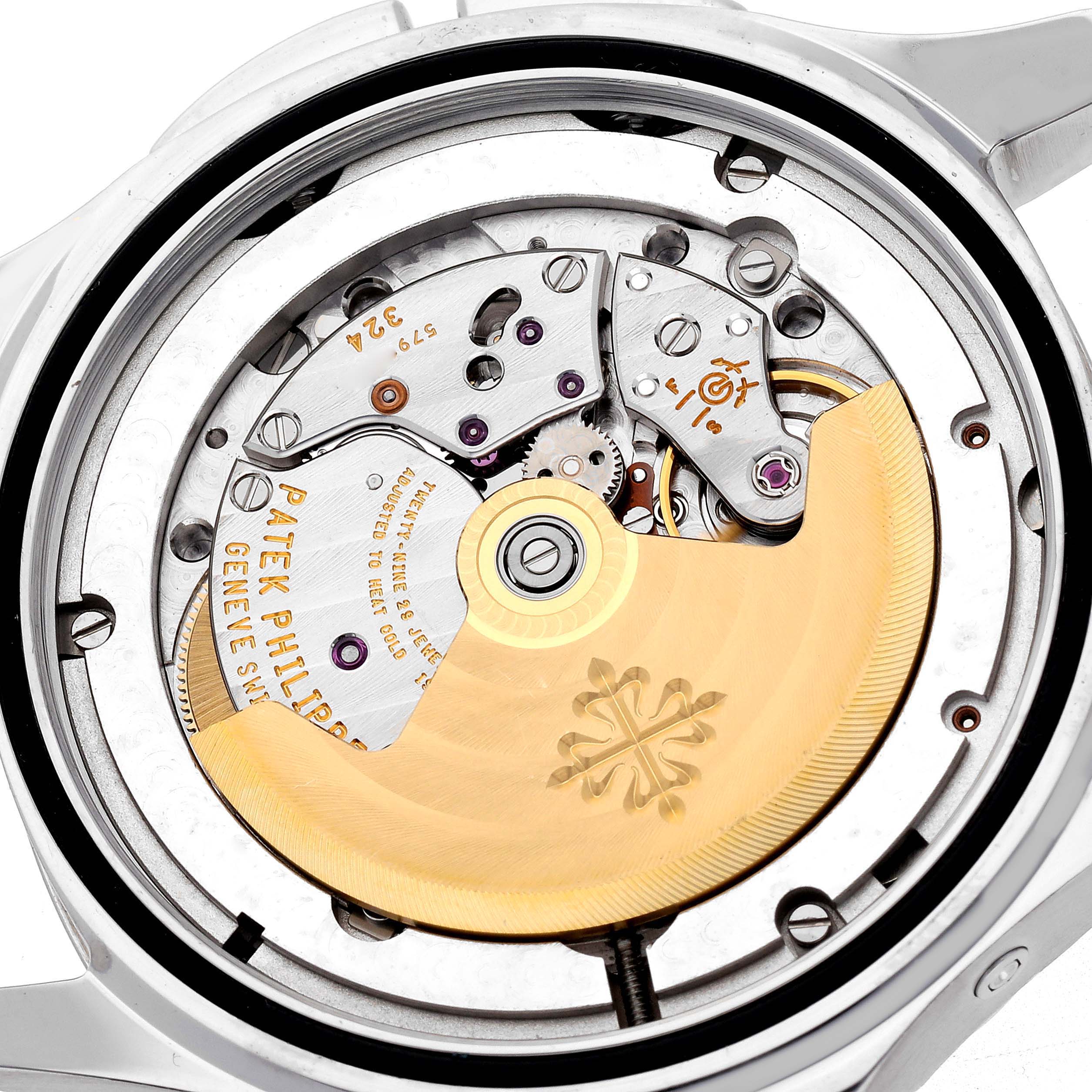 The image shows the back view of a Patek Philippe Aquanaut 5164A-001, highlighting its automatic movement with visible rotor and intricate components.
