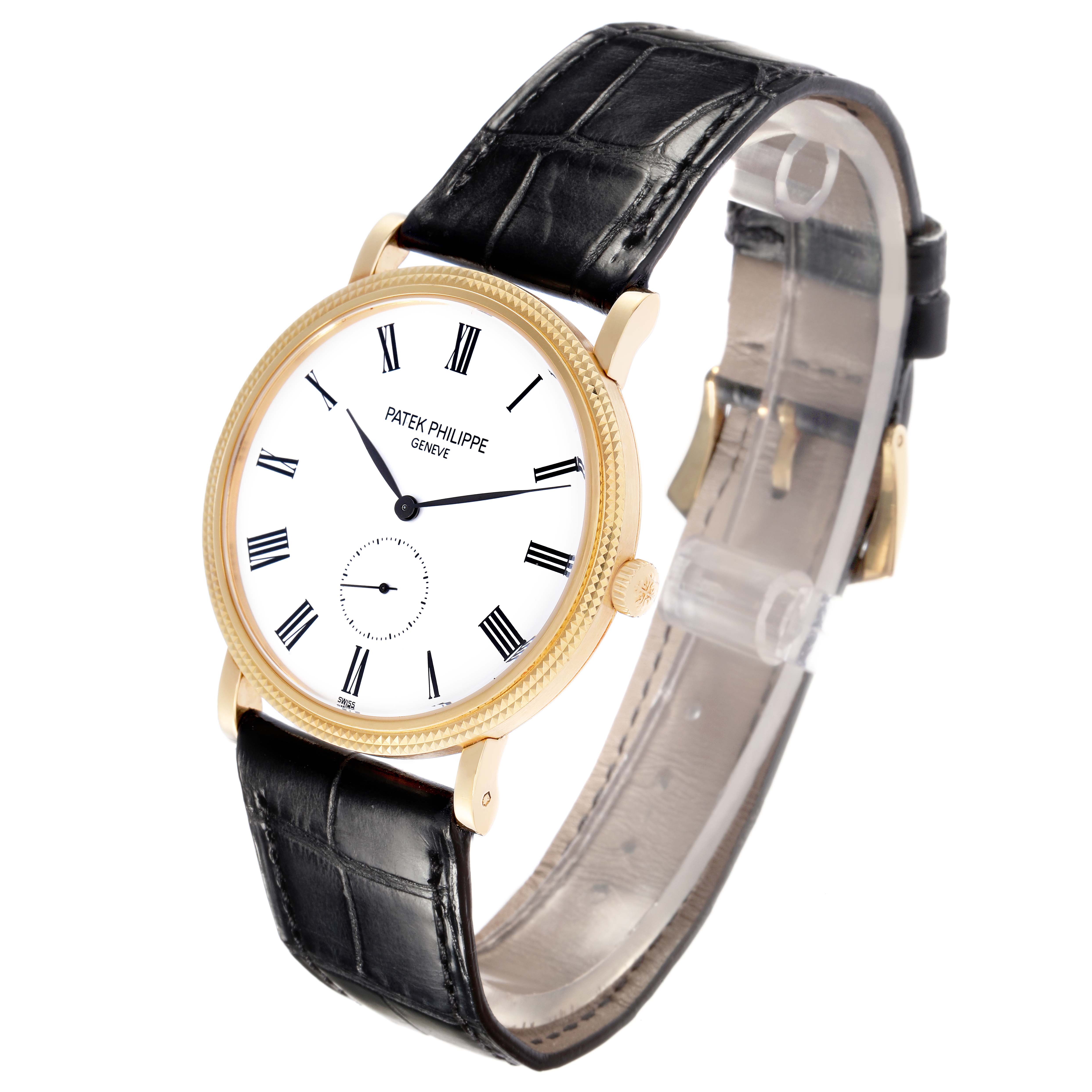 The Patek Philippe Calatrava model 5119J-001 is shown at a slight angle, highlighting the white dial, Roman numerals, black leather strap, and gold case.