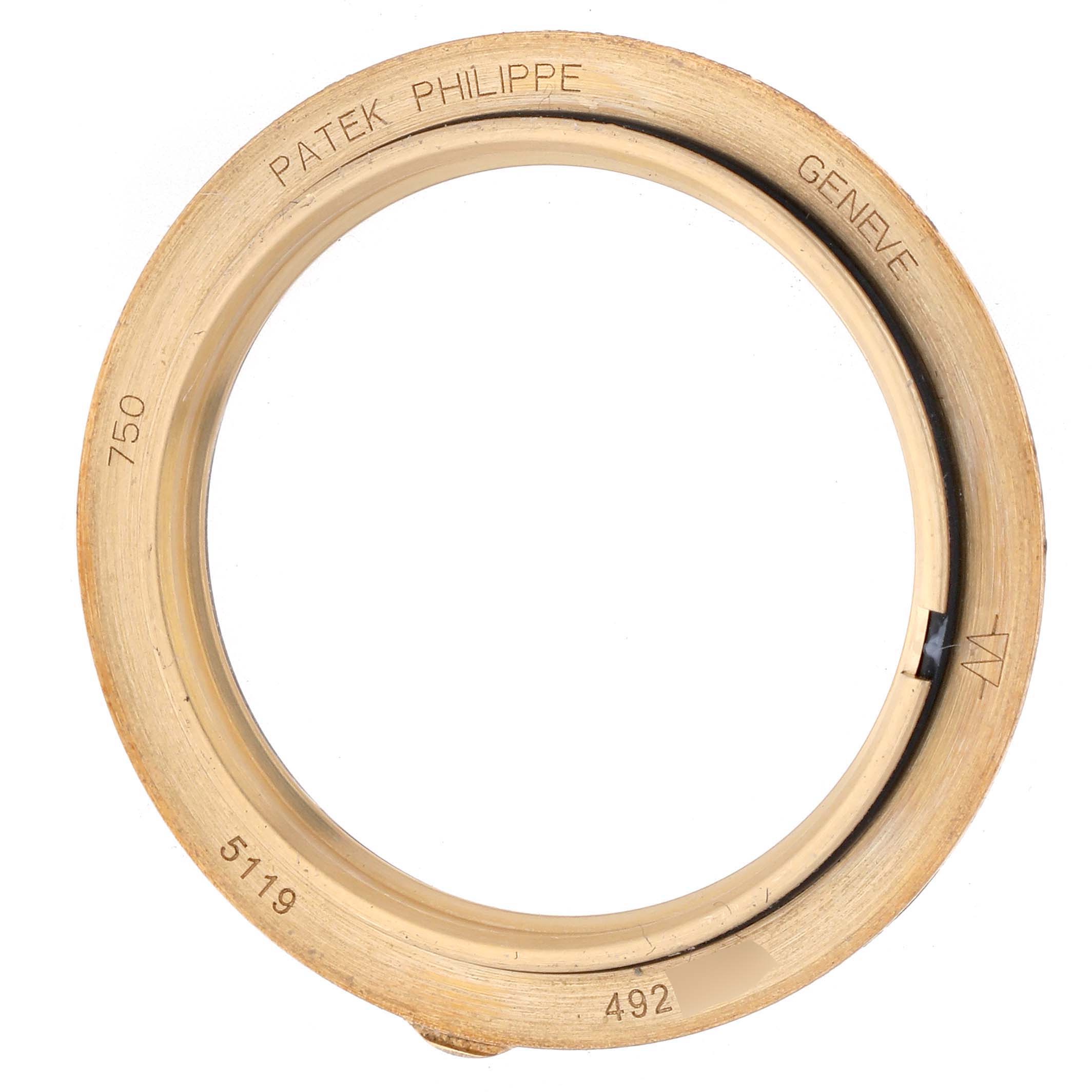 The image shows a gold bezel for the Patek Philippe Calatrava model, model number 5119J-001, viewed from above displaying the engravings and internal components.