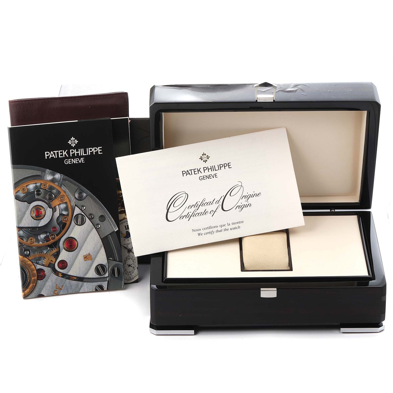 The image shows a Patek Philippe Calatrava (model 5119J-001) watch box, with a certificate of origin and accompanying booklets, viewed from above.