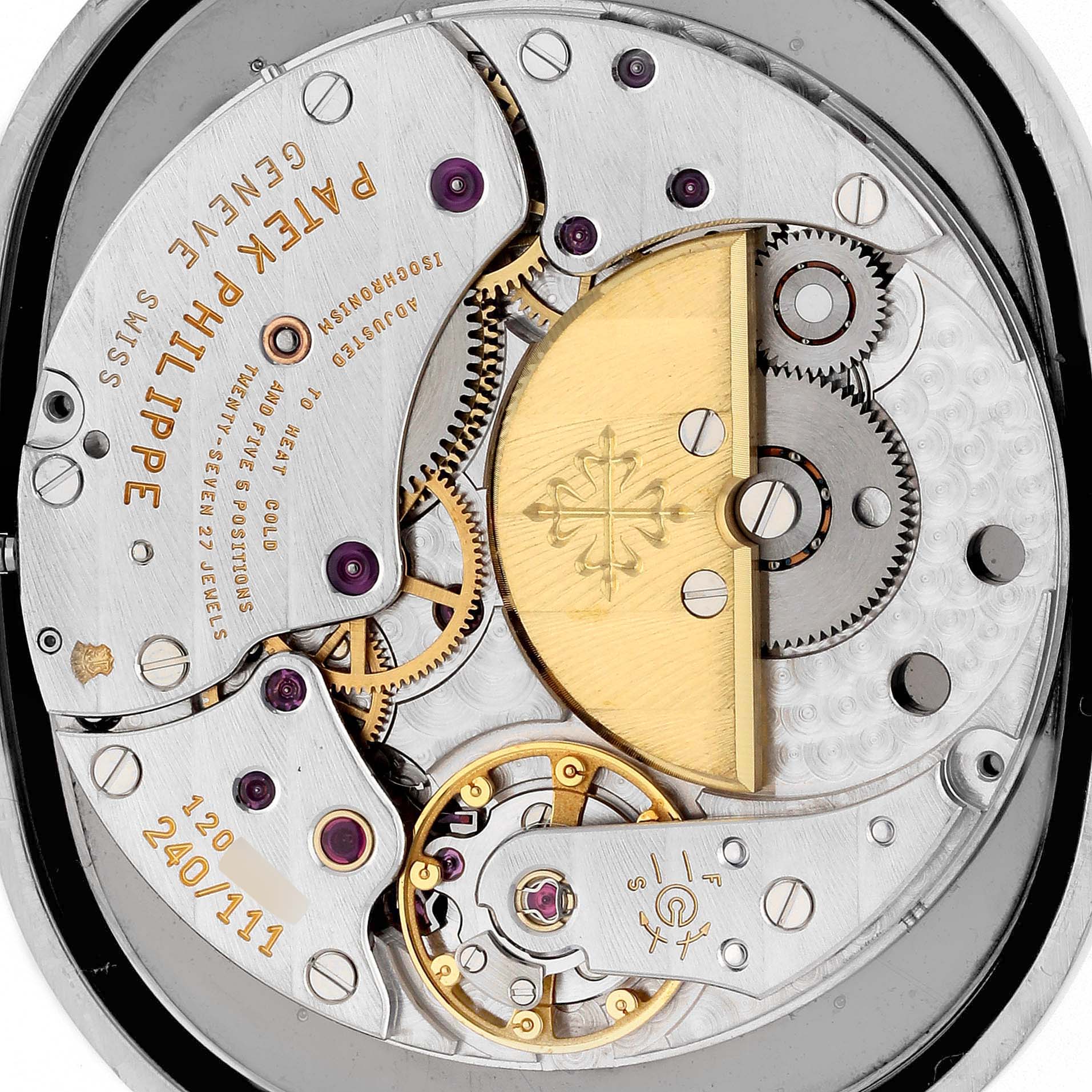 This close-up image of the Patek Philippe Golden Ellipse 3738/100G-012 Men's White Gold Grey Dial 3738/100G-012 Men's White Gold Grey Dial watch shows the intricate inner mechanism and components of the movement.