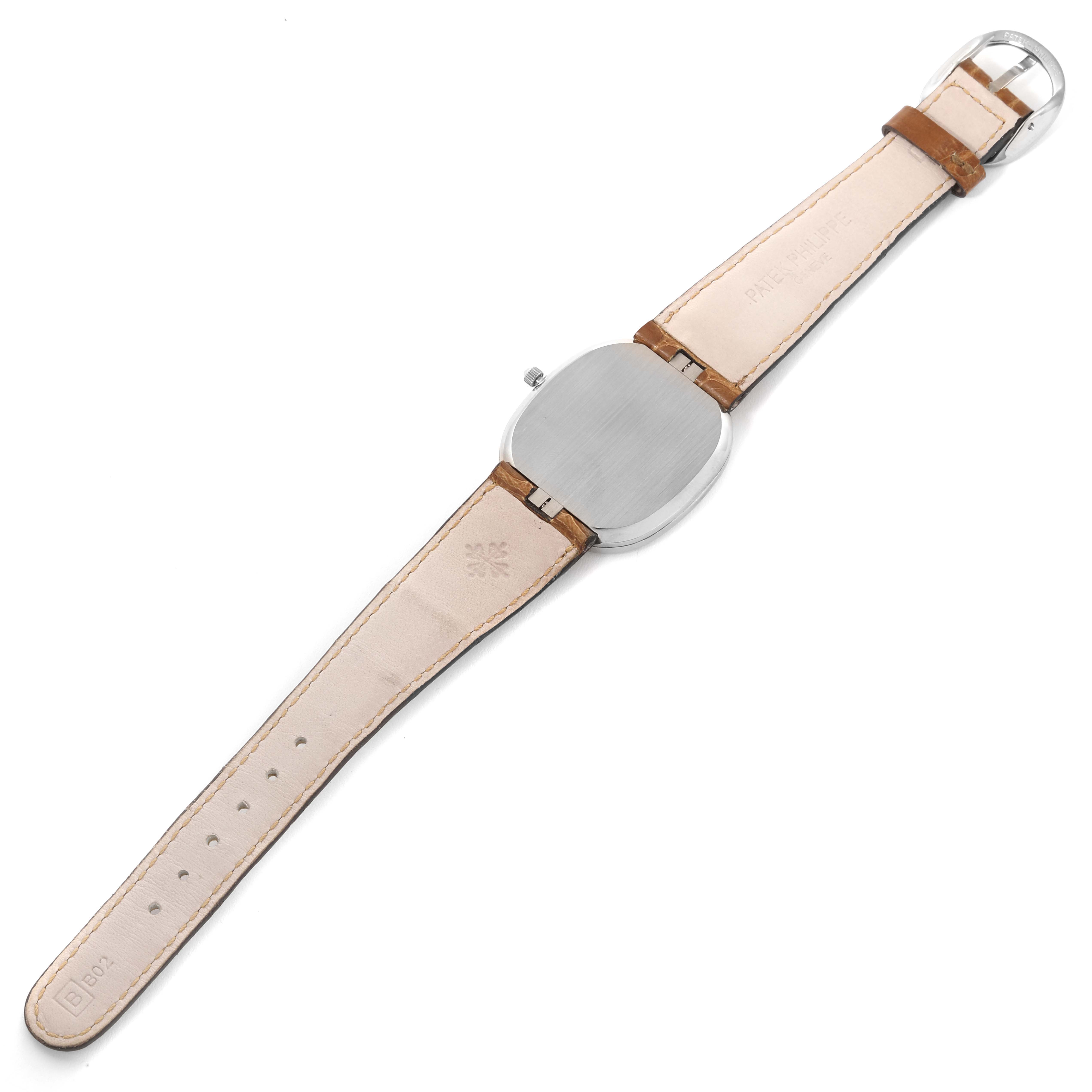 The image shows the back view of a Patek Philippe Golden Ellipse 3738/100G-012 Men's White Gold Grey Dial 3738/100G-012 Men's White Gold Grey Dial model watch with its leather strap fully extended.