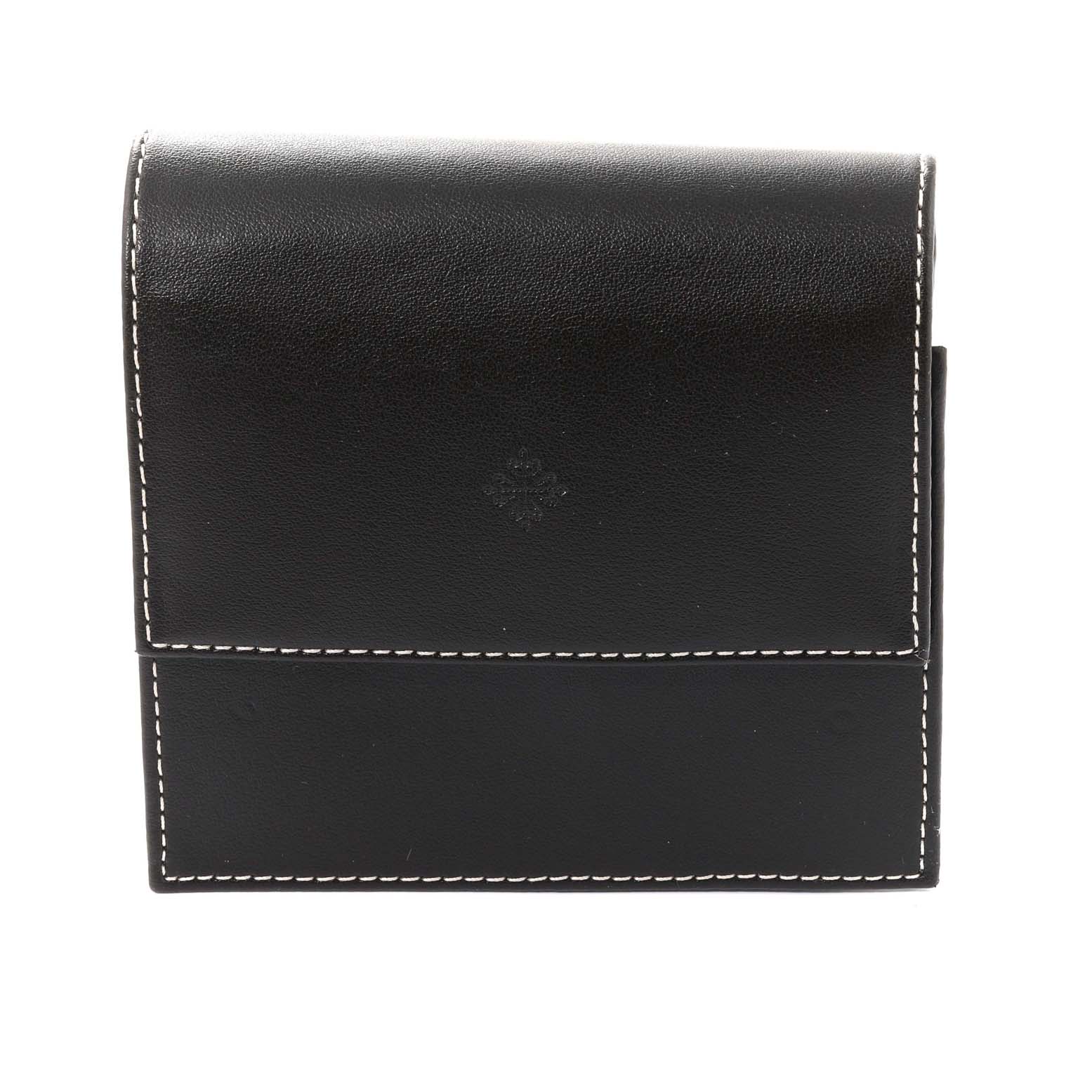 This image shows a black leather Patek Philippe Gondolo 5124J Men's Yellow Gold Silver Dial 5124J Men's Yellow Gold Silver Dial watch case with white stitching.