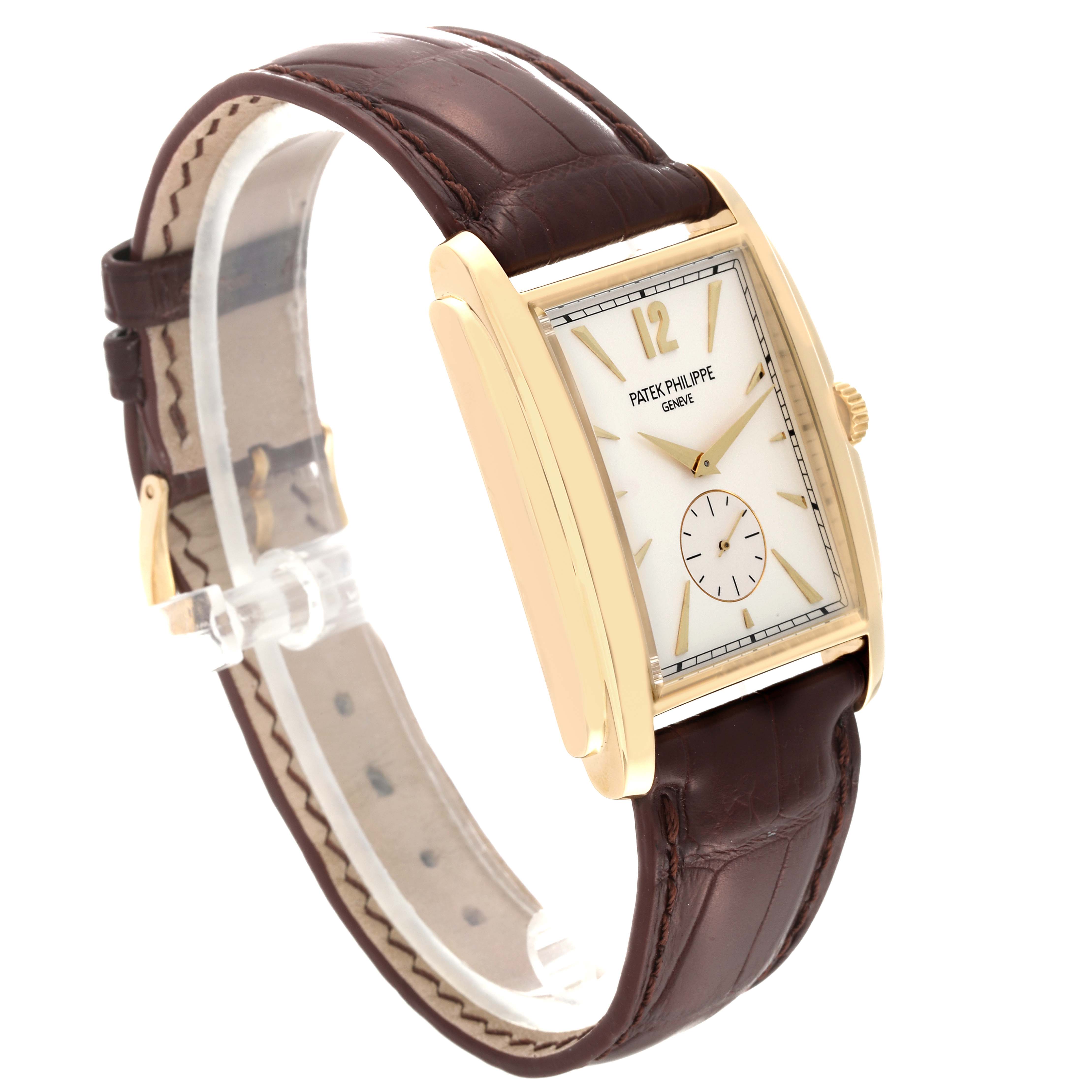 The image shows a side angle of the Patek Philippe Gondolo 5124J Men's Yellow Gold Silver Dial 5124J Men's Yellow Gold Silver Dial watch, highlighting its dial, case, and leather strap.