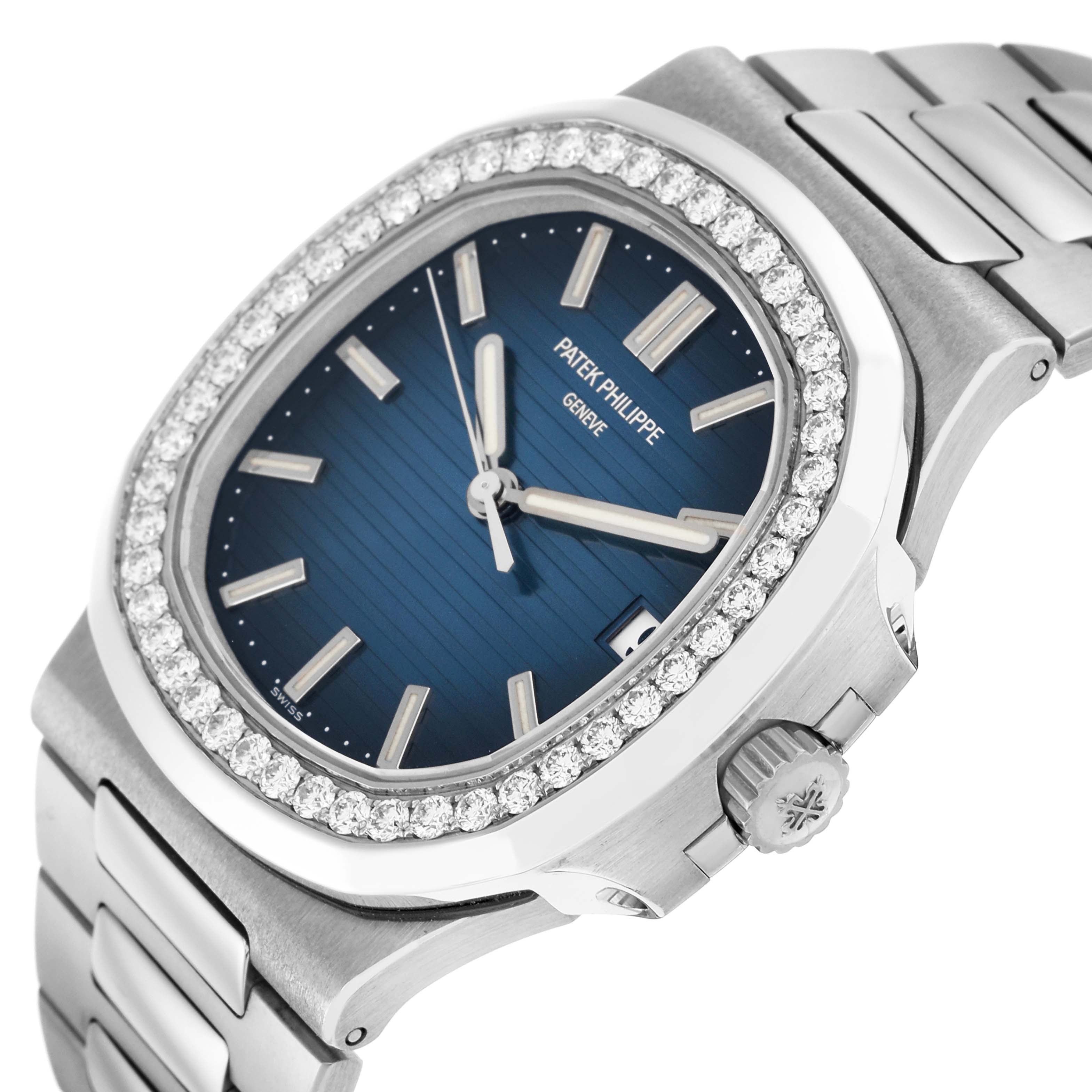 The watch is shown from a slight angle focusing on the face, bezel, and part of the bracelet, highlighting the blue dial and diamond-encrusted bezel of the Patek Philippe Nautilus 5713.
