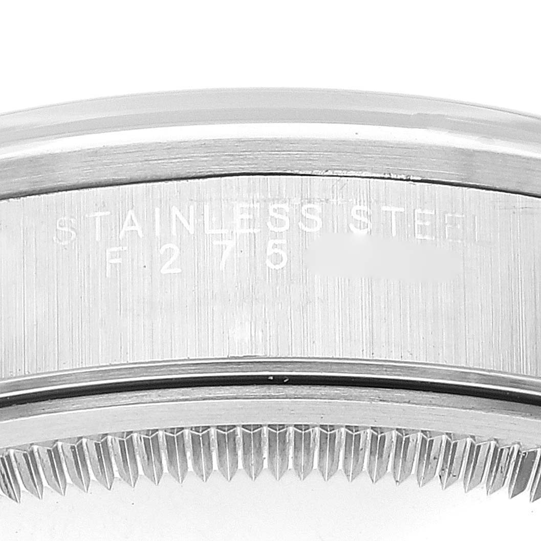 The image shows a close-up of the side and serrated edge of a stainless steel Rolex Air-King 14000 Men's Stainless Steel Black Dial 14000 Men's Stainless Steel Black Dial watch case.
