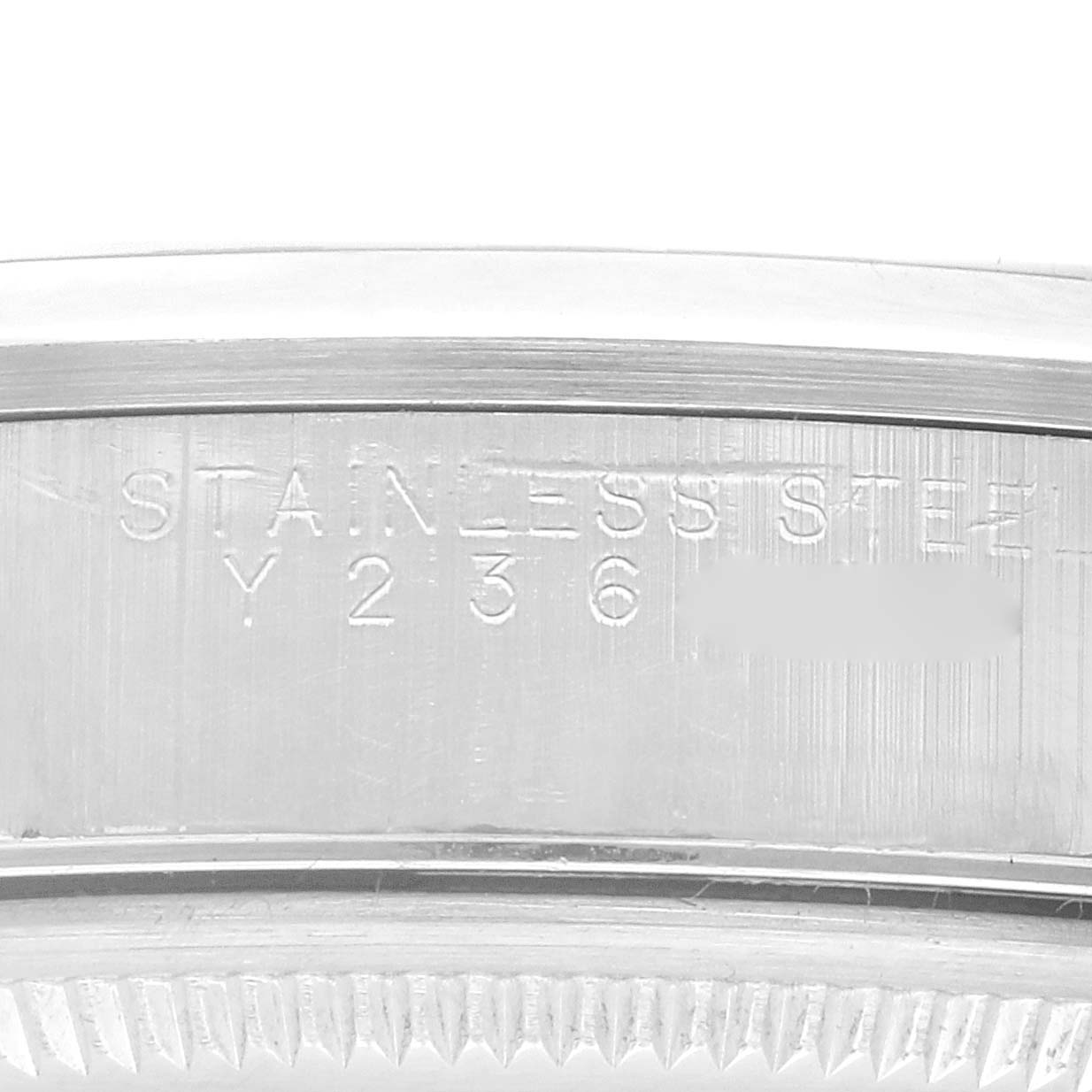 This image shows a close-up view of the back casing and engraving on a Rolex Air-King 14000 Men's Stainless Steel Silver Dial 14000 Men's Stainless Steel Silver Dial watch's case.