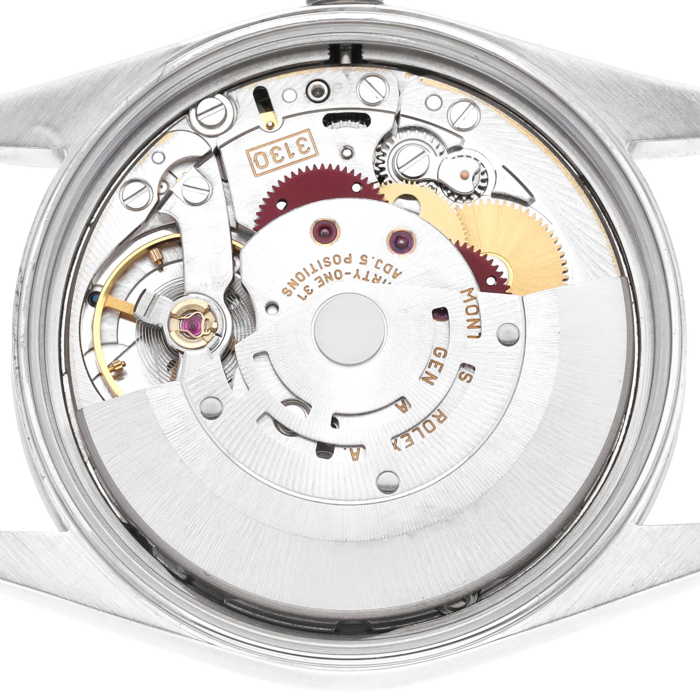 This is a close-up view of the Rolex Air-King 14000 Men's Stainless Steel Silver Dial 14000 Men's Stainless Steel Silver Dial model's internal movement, showcasing gears, springs, and the rotor.